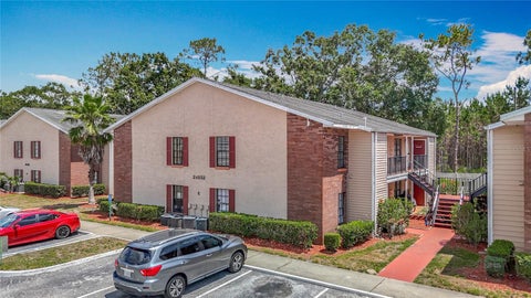 Photo of 21032 Voyager Blvd #8, Land O Lakes, FL 34638 (MLS # TB8533775)