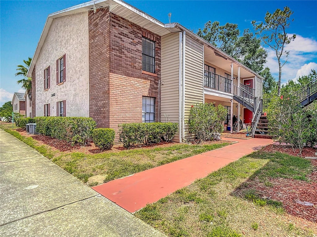 Photo of 21032 Voyager Blvd #8, Land O Lakes, FL 34638 (MLS # TB8533775)