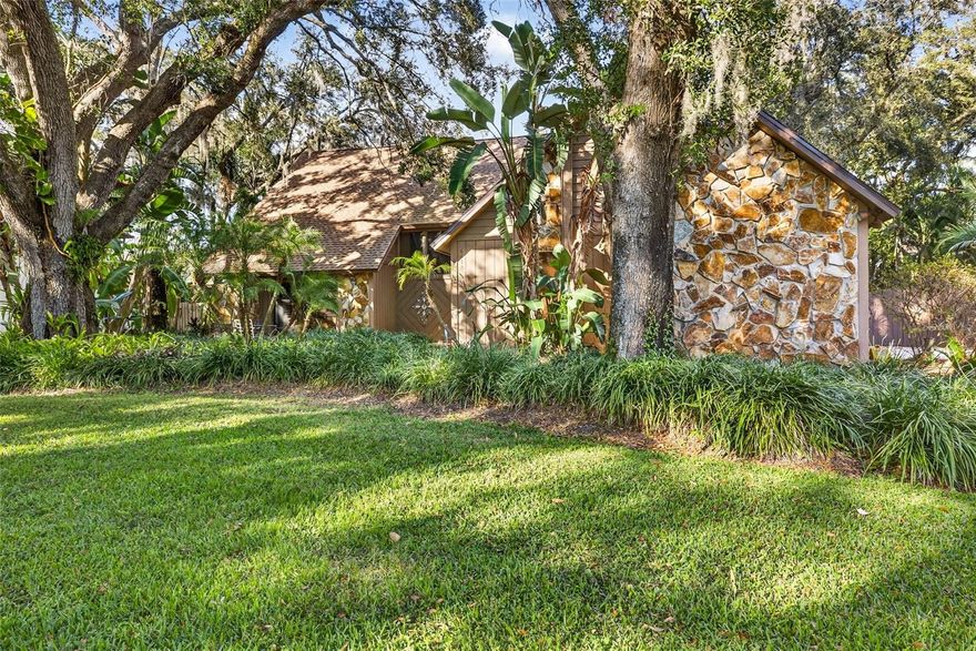 In a setting amongst the beautiful oaks of Temple Terrace , with the Hillsborough River and the Temple Terrace Golf and Country Club in close proximity, this home defines luxury. Walking into this home you immediately notice the 30 ft ceilings with wood  tongue and groove craftsmanship. The open floor plan with the living room and dining room combo overlook a beautiful pool area with lots of space for entertaining. The master bedroom is a true retreat, complete with walk-in closets and an updated master bathroom featuring a stand-up shower and a luxurious jacuzzi tub. An additional oversized bedroom on the ground level opens up to one of the three outdoor entertaining spaces through sliding doors, providing a perfect blend of indoor and outdoor living. The open floor plan is designed to impress, highlighted  With an  updated kitchen sure to please any chef, the kitchen  features an eat-in breakfast nook and bar seating. This phenomenal home also includes two fireplaces, perfect for cozy evenings. Step outside to the screened-in outdoor area where you'll find a heated, saltwater pool with a beach shelf and a waterfall spa, making it an ideal spot for relaxation and entertainment. With three separate outdoor entertaining areas, a fully fenced yard, and tons of storage, this home is perfect for both quiet family time and lively gatherings. Upstairs, an incredible loft overlooks the pool and living space, leading to two more generously sized bedrooms, each with its own loft area. Additional features include a new roof installed in 2023, a reverse osmosis system, water softener, an updated master bathroom with a spa tub, a Bluetooth intercom stereo system throughout the home, and ample storage space. The oversized 2.5 car garage has plenty of space for two cars plus a golf cart. Temple Terrace allows golf carts to be driven on the street one of the few communities that allow this. Within walking distance is the Temple Terrace family Recreation complex one of the nicest in Tampa featuring activities for youth up to elder adults. Located just minutes from USF, Busch Gardens, I-75, I-4, hospitals, Ybor City, and Downtown Tampa, this home offers convenience and accessibility to some of the best attractions and amenities in the area. Schedule a private showing today and experience the perfect blend of luxury, comfort, and convenience!