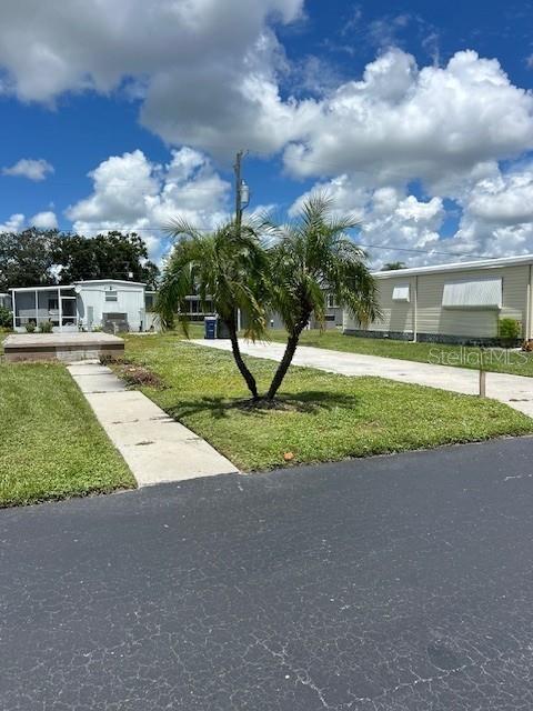 VACANT LOT IN CO-OP READY FOR YOUR NEW MANUFACTURED/ MODULAR HOME. PHOTOS AND ATTACHMENTS REFLECT AVAILABILITY FROM BAY MANUFACTURED HOMES IN TAMPA. THEY ALSO OFFER FINANCING. SITE GOOD FOR SINGLE-WIDE OR DOUBLE-WIDE. GET SET UP AND READY TO ENJOY FOR THE COMING SEASON! DRIVEWAY/ PAD/ WALKWAY REMAIN IN PLACE AND IN GOOD CONDITION. THIS WILL SAVE SET UP TIME AND $$$ FOR NEW OWNERS. 55+ COMMUNITY. VERY LOW MONTHLY FEE. SELLER REVIEWING ALL OFFERS