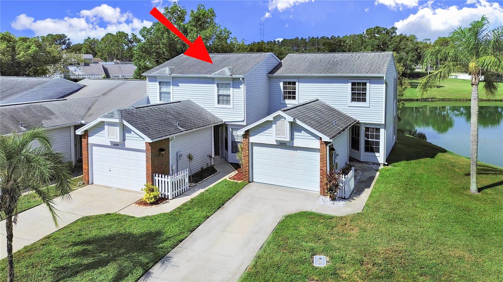 Beautifully maintained 3-bedroom + office + loft, 2.5-bath, one car attached garage townhome backing to a tranquil pond! Located in top-rated A+ school district including Palm Harbor University High school. The thoughtfully designed floor plan features a large living room that opens to the dining room with vaulted ceilings and sliding doors leading to the lanai overlooking a tranquil pond. A dedicated 1st floor office and a nice size eat-in kitchen with newer appliances. 1St floor primary suite with a large walk-in closet, private bath and sliding glass doors leading to the lanai with peaceful water views for your morning coffee enjoyment. Upper floor offers two additional bedrooms and a versatile loft that can be a 2nd in home office, perfect for remote work or study. One-car attached garage for added storage, washer and dryer hookup is available in the garage. Two beautiful swimming pools in the community plus shuffleboard. Cable and lawn care is included. Located across the street from Sutherland elementary school, just minutes from Honeymoon Island, Pinellas Trail, shopping and dining. 10-15 Minutes to Tarpon Springs sponge docks and Howard Park. 20-25 minutes to the beautiful Clearwater beach. 25-30 minutes to Tampa international and St Pete airports. Long Term rent is available. Sorry no pets permitted in this community. Immediate availability.
