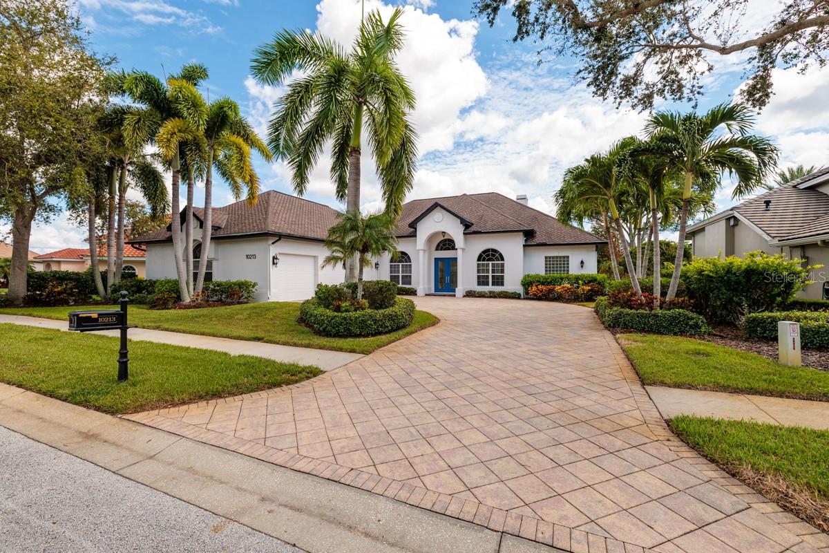Welcome to one of Seminole’s finest homes, in the exclusive Thurston Groves enclave. Positioned in a non-evacuation zone and unaffected by recent storms, this luxurious property has been masterfully remodeled from top to bottom. Step inside, and you’ll be immediately captivated by the stunning 48-by-48-inch tile flooring that spans all the main living areas. The new, open-concept chef’s kitchen is a dream come true, featuring a massive island, premium Wolf gas cooktop and oven, a Wolf steam oven, a GE Monogram refrigerator and a Bosch dishwasher. Custom cabinetry and sleek quartz countertops elevate the space, along with an impressive new pantry that will leave you in awe. Adjacent to the kitchen, a beautiful dining room waits for hosting family and friends. The spacious great room boasts a fireplace and expansive glass sliders that open up to a sparkling pool with an enclosure with pavers, all overlooking a tranquil pond. The primary bedroom suite, which offers direct pool access, is generously sized and includes dual closets for ample storage. The updated primary bath features dual sinks, quartz countertops and a luxurious, oversized shower. On opposite side of the home, you'll find three large secondary bedrooms, each offering comfortable accommodations. The guest and pool baths are equally updated with elegant quartz countertops and sophisticated finishes. The enclosed pool area, complete with a heated spa, sits atop a deck with pavers and overlooks the serene pond, providing some of the best views in the neighborhood. The attached three-car garage is a standout feature, offering nearly 1,600 square feet of space, large windows, a motorized storage lift, an internal vacuum system for cleaning your vehicles and a convenient hand sink, an absolute showstopper. Lastly, the home is equipped with a whole-house generator, providing peace of mind in case of power outages. Don’t miss this exceptional property. Welcome home!