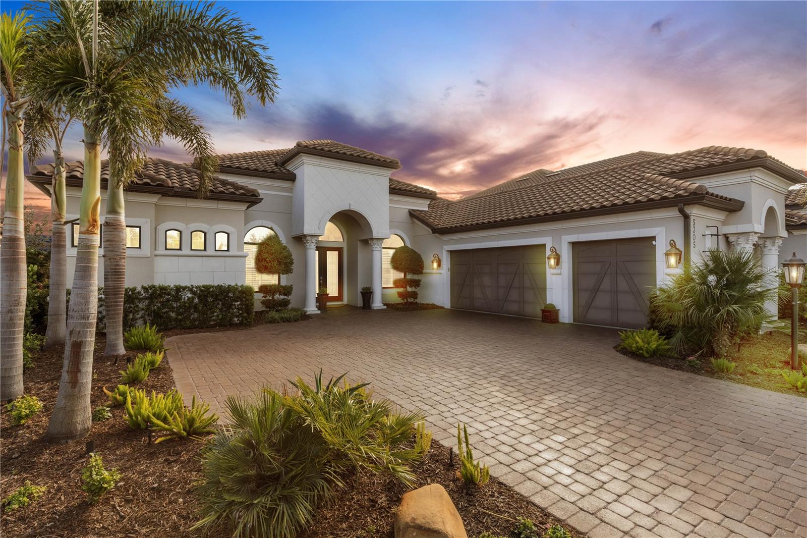 Rarely available Mercedes model pool home with a bonus room in the much sought after community of Legacy Estates at Esplanade on Palmer Ranch. This 3,639 sq.ft 3 bedroom, 3.5 bath, 3 car garage home offers a flexible floorplan with dining room, den, and a large bonus room. Extensive home upgrades include saltwater heated pool with sun shelf and spa, Generac whole house natural gas generator, tankless hot water heater, LED landscape lighting, plantation shutters throughout and hurricane impact windows. The floorplan of this home is made for entertaining with the double convection oven natural gas chef's kitchen opening to the aquarium windowed breakfast area. Pocketing glass sliding doors exit to the pool and spa. The covered lanai has natural gas outdoor kitchen. Lush tropical landscaping to the rear provides idyllic privacy. Upgrades throughout the home include custom espresso hickory wood and tile flooring throughout and cabinetry, light fixtures, custom bedroom closets. Legacy Estates is a gated community with resort-style amenities including pool-side Bahama Bar restaurant, beach entry pool, resistance pool, heated spa, splash pad and play area. The clubhouse features a 24/7 fitness center, yoga room, massage and aesthetics room, locker rooms, game room and onsite management office. Tennis, pickleball and bocce ball courts, dog parks, two direct access points to the Legacy Trail, and nature trails for walking and cycling complete the lifestyle benefits available to residents. The community is conveniently located near some of Florida’s top-rated schools.