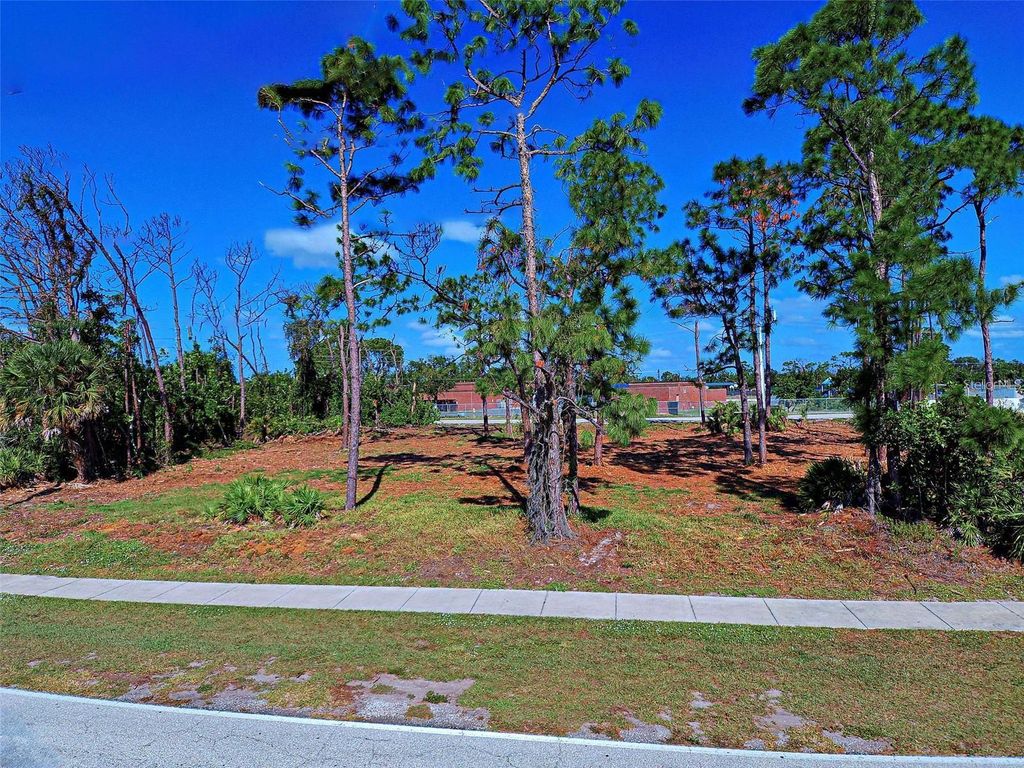 Photo of 471 Boundary Boulevard, Rotonda West, FL 33947 (MLS # N6141434)