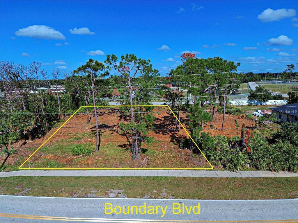 Photo of 471 Boundary Boulevard, Rotonda West, FL 33947 (MLS # N6141434)