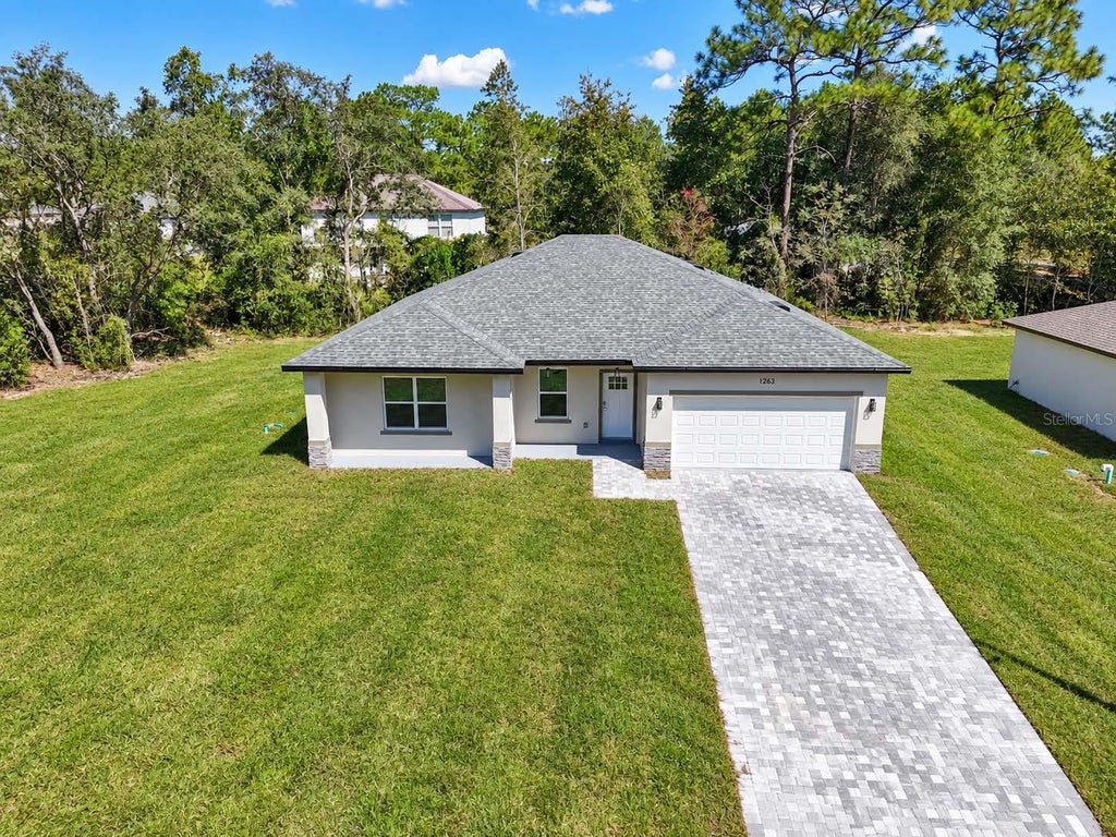 Photo of 1263 W Fan Drive, Citrus Springs, FL 34434 (MLS # OM732795)