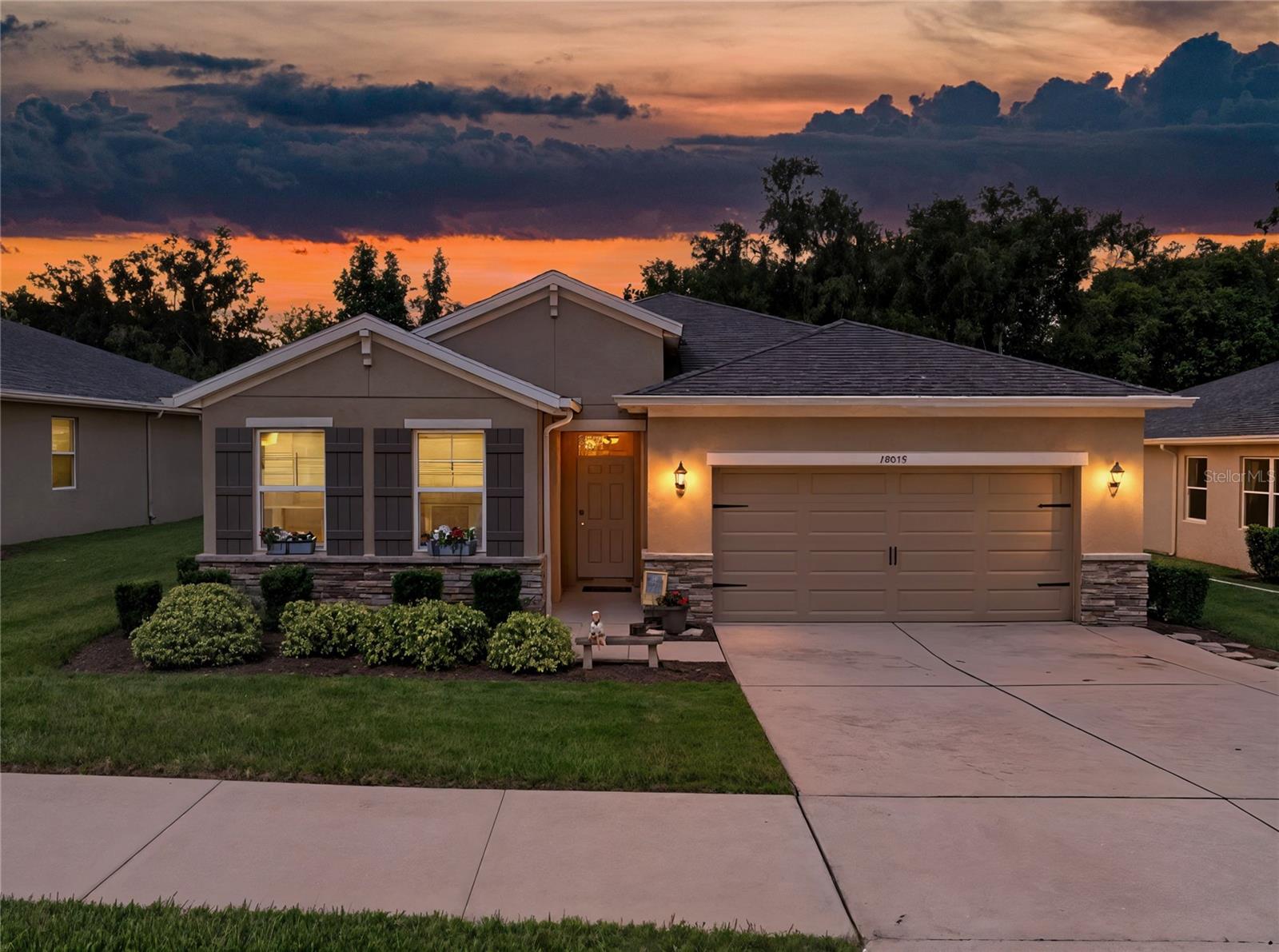 This 2019-built pool home is located in the gated Eastpointe section of Lake Jovita Golf and Country Club and offers 3
bedrooms, 2 baths, and 1,722 square feet of living space. Arrive to lush mature landscaping, sidewalk lined streets, stunning
stone accents, and a covered entryway. The open layout connects the living room, dining area, and kitchen for a practical and
comfortable flow. Easy to maintain ceramic tile flooring runs throughout the main living areas and luxury vinyl plank flooring is in
all bedrooms for maximum longevity and style. The kitchen is outfitted with stainless steel appliances, a center island, granite
countertops, and a pantry. Two bedrooms and a full bath sit at the front of the home, one with French doors that open to the
hallway, making it a great option for a home office or flex space. The primary suite is positioned at the back of the home and
features a walk-in closet with direct access to the laundry room, and an ensuite bathroom with dual sinks, a water closet, and a
walk-in shower with a bench! Head through the dining room’s sliding glass doors to the screened in lanai that offers a spacious
covered seating area and a sparkling swimming pool all with a tranquil wooded background. Enjoy privacy and relaxation in the
Florida sunshine. Additional features include an irrigation system and a two-car garage. The HOA fee covers lawn maintenance
and access to Lake Jovita’s playground, park, walking trails, and the basketball and pickleball courts. Optional membership
packages are available at the Lake Jovita Country Club to include the use of 2 18 hole golf courses, a Jr. Olympic size swimming
pool, tennis courts, restaurant, clubhouse, fitness center, and more! Give us a call today to learn more about this vibrant
community and home!