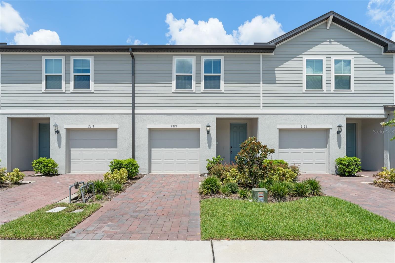 Nestled in the desirable Meadow Woods area of Orlando, this brand-new (2024) townhome offers 3 bedrooms, 2.5 bathrooms, and nearly 1,500 square feet of modern living space designed with energy efficiency in mind. The open-concept layout features a contemporary kitchen overlooking the spacious great room, complete with 42-inch shaker cabinets, quartz countertops, stainless steel appliances, and an oversized island perfect for entertaining. Elegant tile flooring runs throughout the main level, while plush carpeting adds comfort upstairs. The primary suite includes a large walk-in closet and an en-suite bath with dual sinks and a large shower, complemented by two additional bedrooms and an additional full bathroom. A half-bath on the first floor, second-floor laundry room with washer and dryer, and ample natural light throughout add convenience and livability. Outside, enjoy a private paver patio and an attached one-car garage with extra storage. Located in the newly built Chase Landing community, residents benefit from low-maintenance living with HOA-provided landscaping, plus access to a neighborhood playground and walking trails. The location is minutes from Lake Nona’s Medical City, Orlando International Airport, and major highways, offering quick access to shopping, dining, and world-class attractions like Disney and SeaWorld. This pristine rental combines style, comfort, and convenience in one of Orlando’s most sought-after neighborhoods.