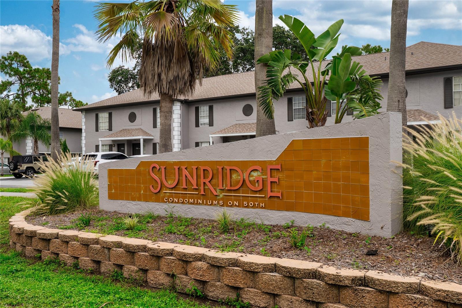 Turn-key, fully furnished 2BR/2.5BA condo in the desirable Sunridge community—just steps from USF and directly across from the new football training field, baseball stadium, and MOSI. This spacious first-floor unit features a split floor plan with two large primary suites, each with walk-in closets and updated walk-in showers. The open layout includes soaring ceilings, large kitchen with stainless steel appliances, a built-in desk/office area, pantry, and interior laundry with washer/dryer. Enjoy wood-look porcelain tile throughout, a half bath for guests, and a large storage room. The screened lanai is accessible from the living room and both bedrooms. Community amenities include a pool, spa, and clubhouse. Ideal as a rental investment or a comfortable place to call home near dining, shopping, and campus conveniences.