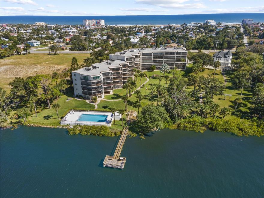 Experience Florida waterfront living at its finest in this beautifully updated two-bedroom residence with a den in the sought-after Pier 43 community. Along the Halifax River, this unique ground-floor unit offers a private back entrance and newly renovated balconies, combining comfort, convenience and style in one exceptional package. Go inside to discover a spacious layout featuring a bright living room, separate dining area and a versatile den, ideal for an office, guest room, or hobby space. The open living and dining areas flow seamlessly to the balcony, where you can unwind and enjoy tranquil river views and glowing sunsets. The kitchen is well-appointed with plenty of cabinetry and counter space, while the bedrooms are privately situated for restful nights. With generous windows throughout, natural light fills every corner of the home. Pier 43 residents enjoy a wealth of amenities, including a riverfront pool and spa, fishing dock, fitness room and clubroom all in a quiet, pet-friendly and secure community. Covered parking and guest spaces add everyday convenience. Near the beach and minutes to dining, shopping and entertainment, this rare unit combines the best of riverfront serenity and coastal access. Whether relaxing on your balcony, casting a line from the dock or strolling to the ocean, this Pier 43 gem captures the essence of Daytona Beach living.