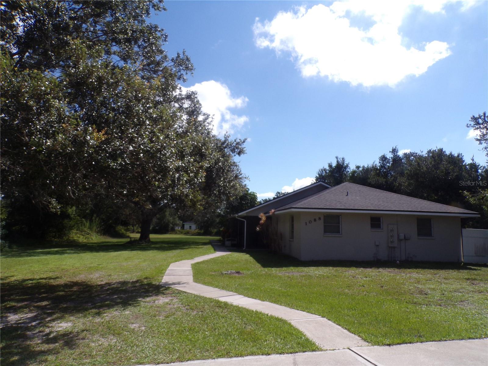 ANNUAL UNFURNISHED 2 Bedroom/2 Bathroom end unit villa located in a triplex on a quiet street in Deep Creek. Screened front porch brings you into open living area featuring new floors and appliances. Washer and dryer hookup located in utility room. Water, trash and lawncare included.