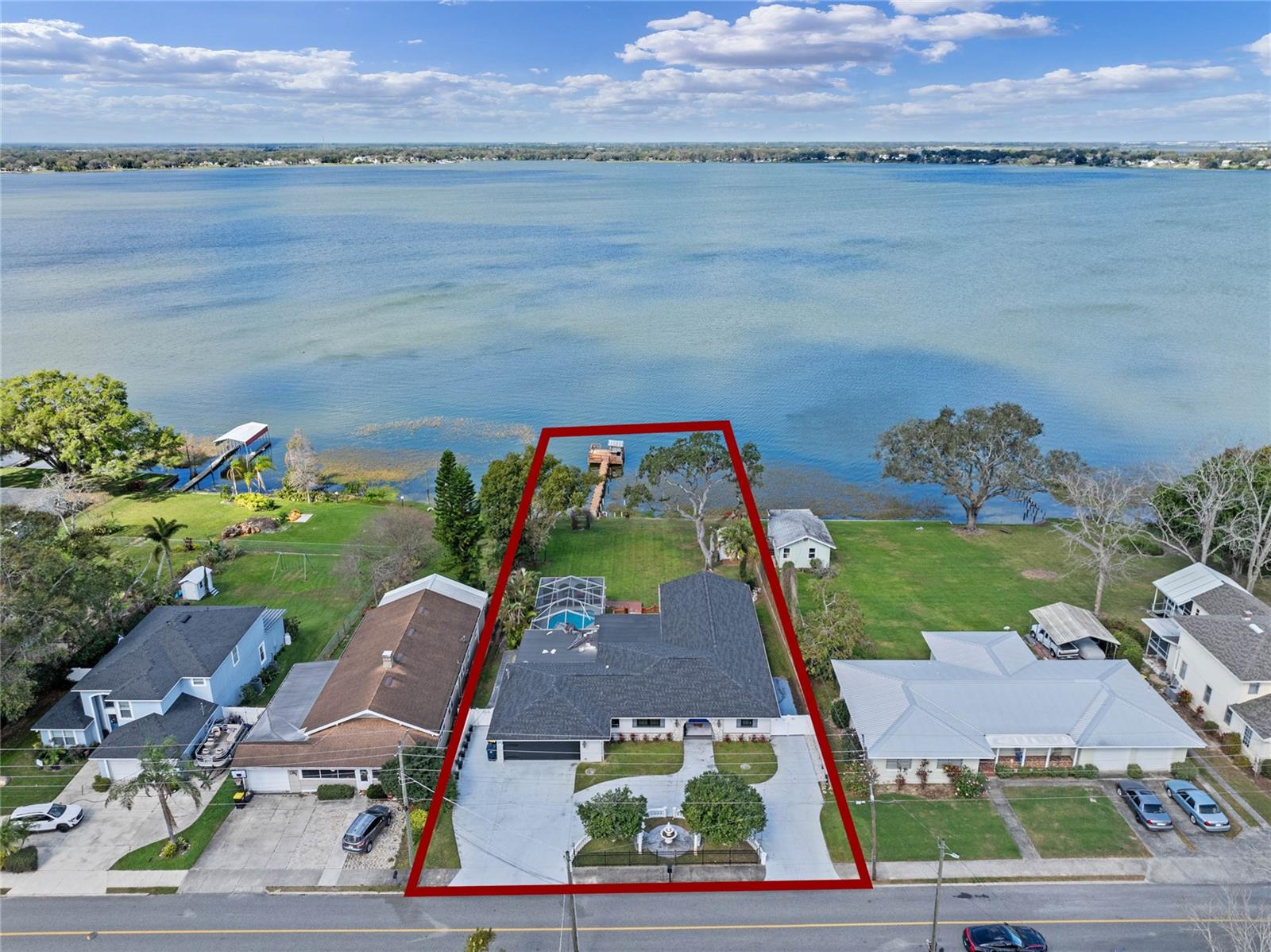 Welcome to 331 Bay Street, a stunning true lakefront retreat with over 100 feet of frontage on the shores of Lake Ariana. This one-of-a-kind home blends Key West charm with luxurious custom features, offering an unparalleled waterfront lifestyle.
This home features three bedrooms, three bathrooms, and three kitchens, designed for both comfort and entertaining. It includes two master suites, each offering space and privacy. The bonus room is equipped with a Show Guns griddle, a gas range, a small refrigerator, and a large island. The Florida Room includes a Jenn-Air grill, allowing for game-day cooking while enjoying the views. Artistic woodwork and indoor waterfalls add to the home's distinctive character.
The luxury master suite includes a spa-like bathroom with a Jacuzzi tub and a hidden, spacious closet. Expansive outdoor living areas include multiple decks, screened-in porches, and an outdoor kitchen complete with ice machines, refrigerators, and two fireplaces. The screened-in pool area features a waterfall, creating a resort-style atmosphere.
A long private dock extends to a Tiki Bar equipped with electricity, water, and music, making it the perfect gathering spot for relaxing lakeside or socializing with neighbors arriving by boat. The home also includes a security system for added peace of mind.
Owner recently replaced one of the back flat roofs with a new roof.
Contact us today to schedule a private tour of this incredible lakefront property.