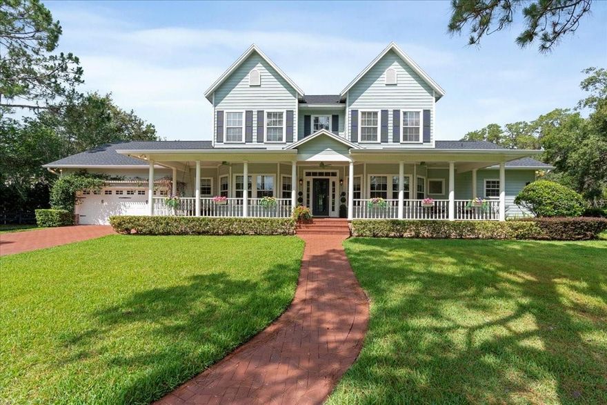 One or more photo(s) has been virtually staged. Classic charm meets modern comfort in this beautifully renovated lakefront home on a rare nearly 9-acre parcel that includes just under 3 high and dry acres and an additional 6 acres of private, spring-fed Lake Mills. With peaceful surroundings, a brand-new roof installed in 2025, and plenty of space to expand, this property offers a truly unique opportunity in one of Seminole County’s most serene settings. Step inside to discover a charming reading room just off the entry, wrapped in windows and filled with natural light. The primary suite is located on the first level, featuring French doors that open directly to the resort-style pool area, with panoramic lake views that make every day feel like a getaway. The kitchen has been fully updated, showcasing sleek quartz countertops and gorgeous light oak cabinetry—a design detail that flows seamlessly into both the laundry room and walk-in pantry. Thoughtfully designed with a mix of modern upgrades and eclectic charm, this kitchen is as functional as it is inviting, perfect for both everyday living and entertaining. The dark and moody office offers a stylish and productive workspace, complete with Ethernet internet for reliable connectivity. Large windows provide inspiring views of the perfectly landscaped front yard, making it an ideal spot to focus while enjoying a serene outlook. The breezy front porch provides a charming place to relax, with lovely views of the beautifully maintained yard—setting the perfect tone for this tranquil lakefront estate. Upstairs, the second floor includes a versatile bonus/game room that highlights the home’s eclectic style, perfect for relaxing or entertaining. The additional bathrooms feature custom finishes and striking glass tile flooring, adding to the unique character found throughout this carefully crafted estate. Homes with this much charm and thoughtful detail are truly one-of-a-kind. The upstairs balcony overlooks the pool, boat garage, and peaceful Lake Mills—offering a great spot to take in those stunning views and relax. This Savannah-style home is also equipped for modern living, with Ethernet wiring throughout for ultra-fast internet and strong Wi-Fi coverage. Built-in speakers in every room connect easily to your devices via Bluetooth, with individual control panels on the walls to turn on/off or adjust volume—seamlessly blending convenience with lifestyle. While the heated living space is thoughtfully sized at 3,767 square feet, the property also includes a ~1,200 square foot boat garage that can be converted into additional living space—offering the potential to add up to 2,000 more square feet to the home. Whether you’re looking to enjoy as-is or dreaming of building out a true legacy estate, this lakefront retreat offers the best of both worlds: privacy, charm, and expansion potential—all with direct access to one of Central Florida’s most beautiful spring-fed lakes. With an acceptable offer, the boat and jet skis may be included—making this a truly turn-key waterfront lifestyle. Schedule your private showing today.