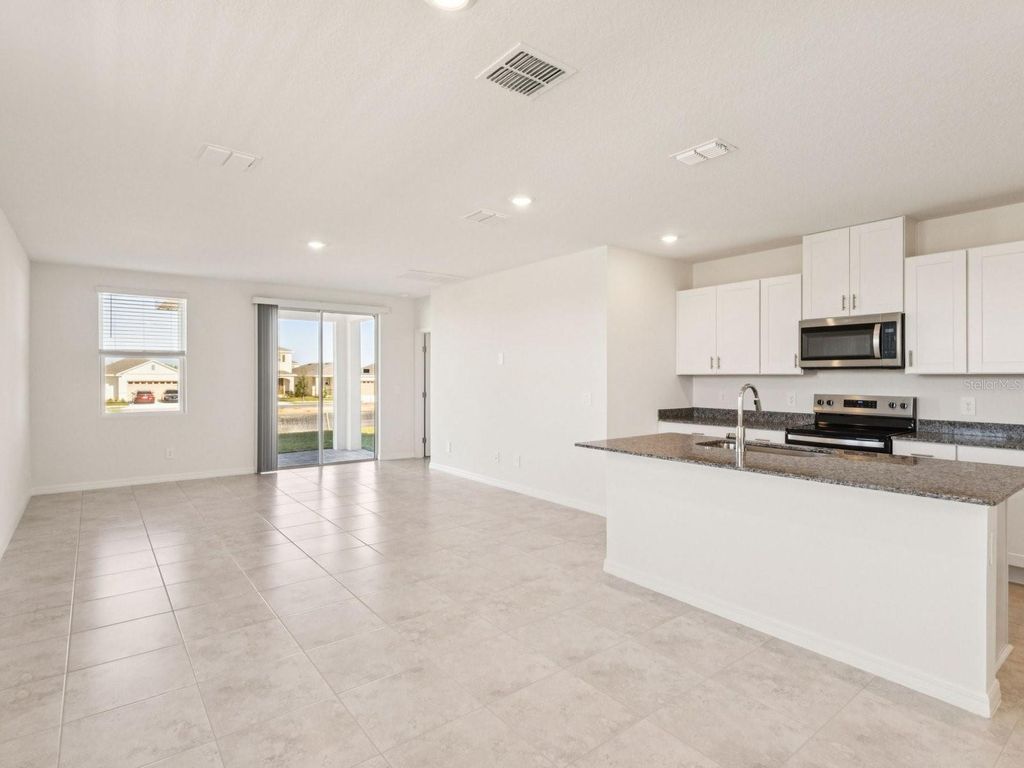 Photo of 4341 River Beacon Blvd, Davenport, FL 33837 (MLS # TB8475139)