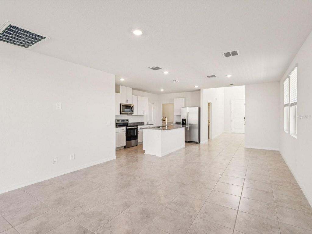 Photo of 4341 River Beacon Blvd, Davenport, FL 33837 (MLS # TB8475139)