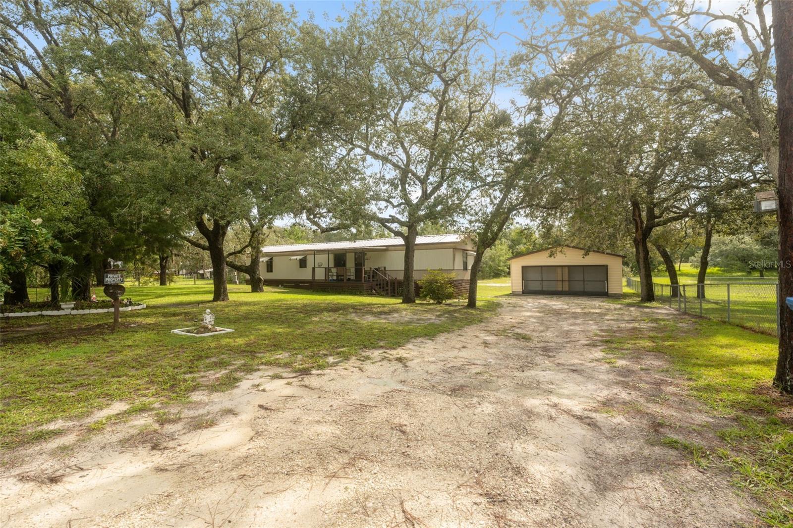 Welcome to this 3-bedroom, 2-bath home located in the desirable Highland Lakes subdivision. Nestled on an oversized half-acre lot, this property offers both space and privacy. A detached garage workshop provides the perfect space for projects, storage, or hobbies, while an additional shed adds extra convenience. The home's open layout flows effortlessly between the living, dining, and kitchen areas, making everyday living and entertaining a breeze. The kitchen is well-appointed, and each bedroom includes generous closet space, with the primary suite featuring its own private bath. Step outside to enjoy the screened-in back deck—ideal as a 3-season room for relaxing or entertaining year-round. The 2-car garage is fully screened, perfect for additional covered space or shaded gatherings. For those who love the outdoors, you’re just minutes from Weeki Wachee Springs State Park for kayaking and swimming, or head over to Pine Island Beach to swim in the Gulf. The Bayport boat ramp is also nearby, offering direct access to the Gulf for boating and fishing adventures.