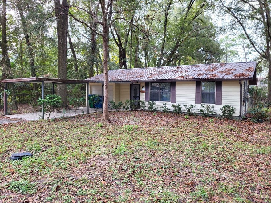 INVESTOR ALERT  This home is in need of some renovation to be the best it can be again. It's located on a quiet side street in an older neigborhood not far from the downtown business district. The wooded lot is 1/3 acre with a chain-link fenced back yard and a screened back porch. There's a single-car attached garage and a one-car carport in front of it. The roof is metal, and the siding is vinyl. 832 square feet of living space with 1 full bath and a half bath off the kitchen. Central air and heat. City water and sewer. The homesite offers good privacy in relation to neighboring homes, and there's very little traffic passing in front.