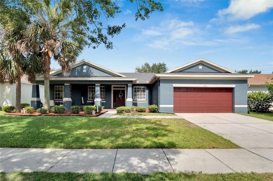 Located in the Rivercrest community, this gorgeous 4 Bed, 3 Bath home has a welcoming façade with the winning combination of exterior color, a large open front porch, and mature landscaping.  Step inside and take in the high ceilings, fresh interior paint, 5 1/4" baseboards and wood-look tile for easy maintenance with an open and airy feel.  The front living and dining areas provide flexibility for casual or formal entertaining.  This flows right into the eat-in kitchen with lots of warm, wood cabinetry, plenty of counter space, a closet pantry, breakfast bar, and stainless-steel appliances.  All this overlooks the family room with sliders to the screened lanai and fenced backyard.  The bedrooms are on a split plan with a property master retreat that includes a large bedroom, a walk-in closet, and a bathroom that features dual sinks, a soaking tub, and walk-in shower.  The three, secondary bedrooms share two full baths, one being a Jack and Jill bath with access from two of the bedrooms which provides an easy flow from one to the other.  With a newer roof (2021), fresh interior paint, and professionally cleaned tile flooring throughout, this home is pristine and ready to move in. Enjoy all the Rivercrest community has to offer including the pools and water play area, playground and play field, tennis, basketball, and fitness trail.  Thank you for your interest and for taking the time to see this beautiful home in person.