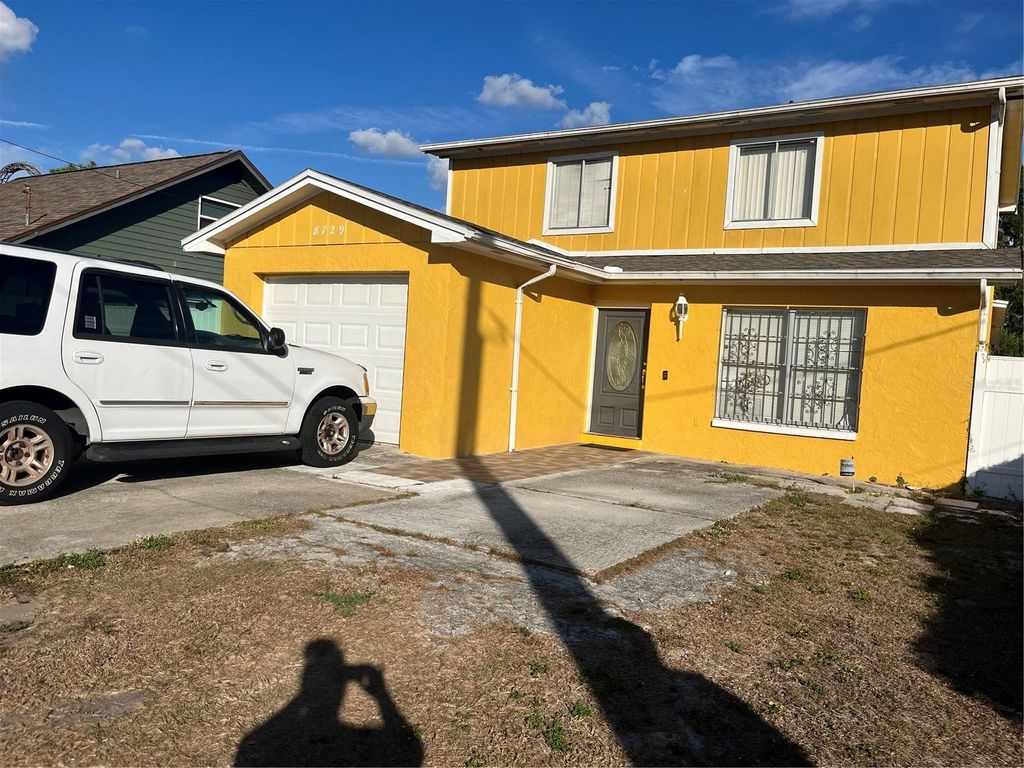 Photo of 8729 N Calder Place, Tampa, FL 33604 (MLS # TB8452243)
