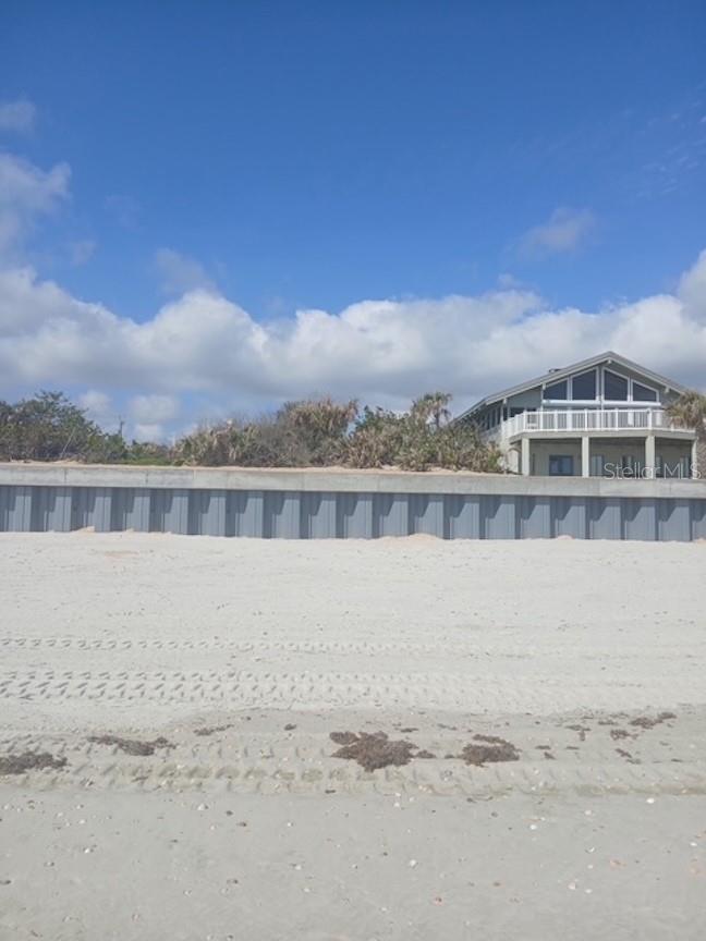 Build your beachfront paradise on one of the last direct oceanfront lots in upscale neighborhood on Van Kleeck Drive. Be among the most luxurious and beautiful homes on the ocean in a peaceful and quiet setting on the no drive beach. No public access nearby. Outstanding ocean views on this large and deep parcel. Concept photos and floorplan on request. Newly constructed seawall.