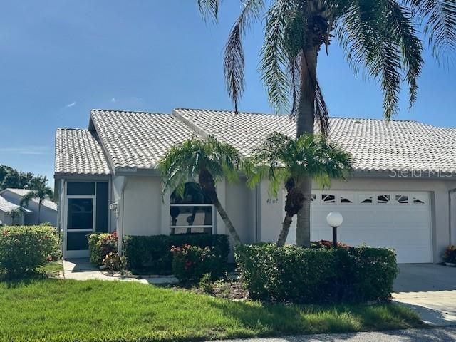 3 BED / 2 BATH / 2 CAR GARAGE VILLA with 1,803 SQ.FT. OF SPACIOUS LIVING AREA * ALL AGES WELCOME * LOCATED JUST A SHORT STROLL TO THE CLUBHOUSE AND POOL IN THE HEART OF SARASOTA! * NEW TILE ROOF (2026) * NEW AC (2024) * This meticulously maintained and immaculate MOVE-IN READY villa features DRAMATIC VAULTED CEILINGS and a light, bright, happy, OPEN FEEL. The 3-bedroom split floor plan allows for maximum privacy for guests while the LIVING ROOM – FAMILY ROOM – DINING ROOM COMBINIATION is perfect for entertaining. The family room has sliding glass doors which open to an EXPANSIVE SCREENED LANAI where you will love to relax outdoors and visit with friends and family. The peaceful garden view to the rear of the home faces east so you you are able to enjoy the shade in the late afternoon. The fully remodeled kitchen offers modern appliances, quality soft-close cabinetry, granite counters, under sink R/O, and an ample pantry. The Primary bedroom offers TWO LARGE WALK-IN CLOSETS and a sitting area. Other recent upgrades include interior paint, new fixtures, partially remodeled bathrooms, commercial garage floor finish, and new quality ceramic tile. Crestwood Villas is a warm, friendly, and inviting neighborhood where your LOW HOA OF JUST $758/MO INCLUDES YARD MAINTENANCE, CABLE TV, COMMUNITY AMENITIES, MAINTENANCE OF YARD AND BUILDING EXTERIOR. Amenities include SOCIAL CLUBHOUSE, HEATED POOL, TENNIS, and a full social calendar which includes holiday gatherings. This boutique enclave is located minutes from DOWNTOWN SARASOTA, SIESTA KEY, A RATED SCHOOLS, restaurants, Publix grocery store, Doctor’s Hospital, and UTC Shopping and Entertainment District.