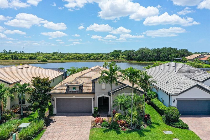 Model perfect maintenance free home with expansive water views in Sandhill Preserve. This popular Abbeyville floor plan features 2 generous bedrooms, den & 2 baths. Large neutral  tiles on the diagonal throughout the entire home (no carpets). Open kitchen concept with upgraded appliances, large center island & soft close drawers. Stadium shower in master bedroom bath. 2 car garage with epoxy floors. Hurricane shutters for all openings. Sandhill Preserve is one of Palmer Ranch's newer communities with only 308 homes* The community features a community pool, jacuzzi, fitness center, pickle ball, club house, fire pit, barefoot bar area tennis & more. Located in the heart of Palmer Ranch just minutes from world famous Siesta Key beach, shopping, restaurants & Legacy bike trail*