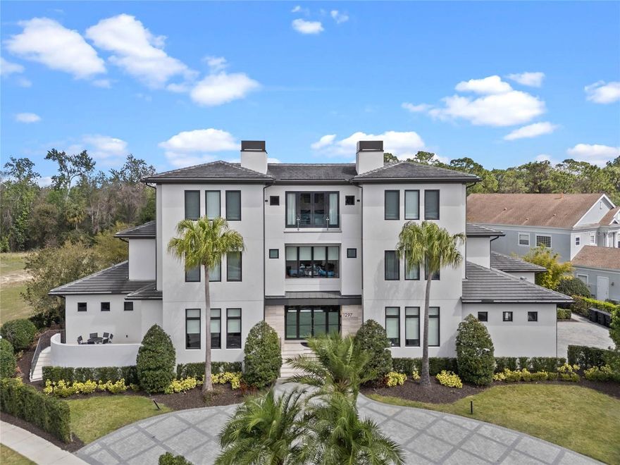 Introducing Isole Villa a one of a kind vacation home investment opportunity offering an extraordinary blend of modern elegance & timeless sophistication nestled within the exclusive gated community of Reunion Resort. This contemporary estate spans over 23,000 square feet of opulent indoor & outdoor living space, featuring 15 exquisitely appointed suites, 17 full baths, & 6 half baths. 
As you enter the double grand foyer, you’ll be captivated by soaring 24-foot ceilings, crystal chandelier, sweeping staircase & artful display of the raised lounge overlooking the stunning grand dining room. Designed for lavish gatherings, the area comfortably seats up to 40 guests complemented by custom lighting, wine cellar & accordion style retractable doors blending indoor elegance with the serene Florida outdoors, views of the lush grounds, expansive multi-level saltwater infinity pool & comfortable lounge areas.  
Level 1: The Heart of Entertainment
Host an unforgettable cocktail party in the Great Room with luxurious seating or enjoy live music in the raised piano salon featuring a grand piano. For business needs, the executive boardroom is equipped with a business center with presentation capabilities & private terrace. Also, on the first level you'll enjoy the gourmet kitchen, a full commercial grade catering kitchen, dining area & family room. 
Active pursuits include shooting hoops in the indoor sports court or team-building activities like yoga. End the evening with a private screening in the home theater boasting seating for 19, innovative surround sound & snack bar.
Level 2: Luxurious Suites & Modern Amenities
The second level offers 11 one-bedroom suites, each bathroom is a masterpiece, finished with beautiful marble & modern amenities.
Catch every game-changing play in the modern sports lounge with multiple TVs & club seating. The Playroom features creative seating, video games, craft tables & a reading nook.
 Level 3: Presidential & Ambassador Suites
Retreat to the third level, home to four well-appointed suites & an executive lounge. Experience ultimate privacy in one of the two Ambassador suites with contemporary styling & luxurious finishes including spa soaking tubs & walk-in showers.
The Presidential suites provide a perfect evening hideaway, impeccably designed with private terraces & stunning baths. The executive lounge exudes the charm of a classic 19th-century London cigar bar with onyx marble, wood & leather accents, a fireplace & relaxed seating.
Spa & Wellness Sanctuary
Indulge in the private spa, a sanctuary of peace & rejuvenation. Enjoy spa treatments in one of two treatment rooms or unwind in the Turkish steam room & dry redwood sauna. With two full baths & one half bath in the Spa Level & full fitness center, every detail is crafted for your comfort.

Reunion Resort is a luxurious vacation destination located near all that Central Florida is famous for and just a few miles from Walt Disney World. Along with 3 signature championship level golf courses designed by golf legends Jack Nicklaus, Tom Watson & Arnold Palmer, you'll enjoy a variety of restaurants from fine dining to more casual options along with poolside bars and coffee shops to start your day while never having to leave the resort. Additionally, there are multiple pools, onsite water park, kid's play areas, tennis, picklelball, fitness center & more.