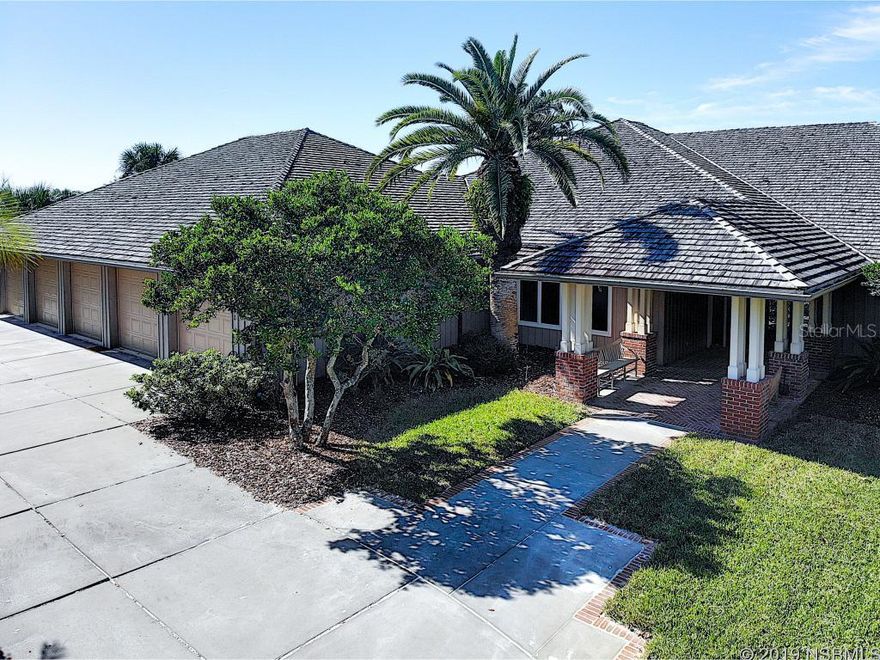 Enjoy north beach living at its finest in this four bedroom, custom built, pool home.  Featuring an amazing one level floor plan with 10â ceilings.  One of a kind, five car garage with storage.  Just steps to the ocean, close enough to hear the waves hit the sand.  Enter the residence from the U driveway into a formal entry way.  Step down into the living area with French doors leading to magnificent pool area.  Formal dining room with large windows to take in the light.  Kitchen is open to the family room and breakfast nook. Family room offers wood burning fireplace and built in bookshelves.  Larger laundry room and separate built in buffet pantry off kitchen area.   Kitchen offers, center island, Sub-Zero refrigerator-freezer, Viking six burner- gas top stove, blower vent system, warming drawer, wine refrigerator, new microwave, two dishwashers, three sinks, and spaghetti pot faucet.  Pull out cabinets and Lazy Susan (s).  Separate bedroom off the kitchen with full bath and walk in closet, currently being used as an office.  Half bath in this location as well.  North wing of home offers, second half bath, two full bedrooms each with private bath and large closets plus the fully concreted safe room, along with the master suite.  Master suite offers his and her closets, walk in shower, jacuzzi tub and two vanities.  Bidet and standard commode.   Beverage refrigerator not operable and secluded outlet to private spa area.  Heart of Pine wood flooring, tile and carpet.  Flagstone pavered, heated pool area heated spa.  Pool is fresh water and Pebble Tec finish.  Separate grassy area.  Entire property fenced.  Essential generator regularly serviced.  Two ac units about four years old.  See attached detailed spec sheet on home for more details.    Location is perfect: close to Flagler Avenue and the Smyrna Dunes Park. ;Water: City