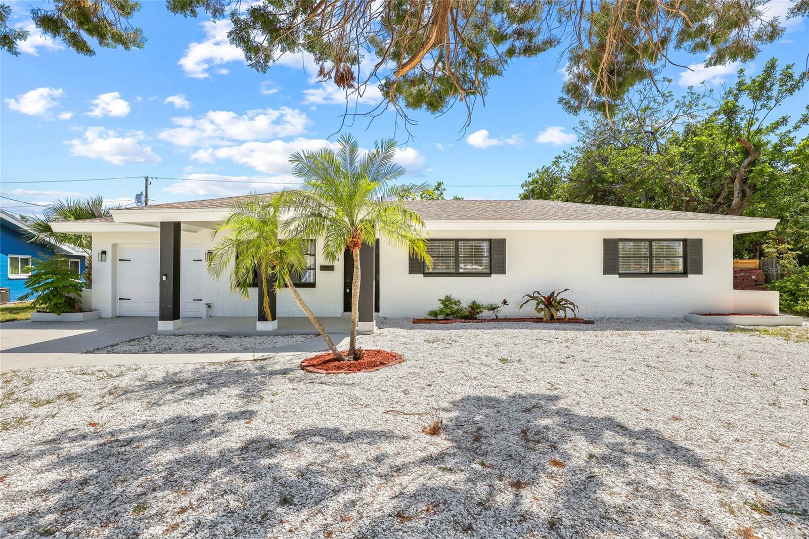 Priced To SELL! Welcome to this stunning, fully renovated 4-bedroom, 2-bathroom home in the heart of Wedgewood Park—offering NO HOA and its located in a Non FLOOD ZONE! Meticulously updated, this home is move-in ready with brand-new features throughout. Step inside to an open floor plan with abundant living space, featuring luxury plank tile flooring and new carpet in all bedrooms. The gourmet kitchen boasts brand-new stainless steel appliances, quartz countertops, and upgraded LED lighting. Both bathrooms have been fully renovated with modern fixtures, quartz countertops, and luxury plank tile flooring. Major updates include a new roof (2020), HVAC (2018), and a brand-new water heater and ad brand new garage door and garage door opener (2025). Freshly painted inside and out, this home offers a massive backyard—perfect for outdoor activities, pets, or even a future pool. Enjoy the prime location, just minutes from Beaches, shopping, Downtown St. Pete, Boyd Nature Preserve, Lake Vista Park, and the Lakewood Sports Complex. Don't miss out on this incredible opportunity—schedule your private showing today!