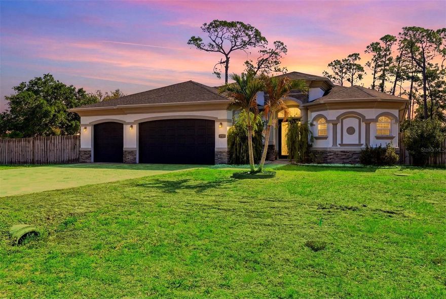 One or more photo(s) has been virtually staged. Located in a highly sought-after area of Southwest Florida, this impressive 3-bedroom, 2-bath, 3-car garage custom pool home sits on an oversized double lot and offers the perfect blend of space, functionality, and Florida lifestyle living. With no HOA and situated in a no flood zone, there’s plenty of room to bring your toys and enjoy true freedom.

From the moment you arrive, you’ll be impressed by the paver driveway and exceptional curb appeal. Inside, the home features an open and airy floor plan filled with natural light, highlighted by 13-foot tray ceilings with multi-level crown molding, 8-foot doors, 18” porcelain tile throughout, decorative niches, and zero-edge sliding glass doors that showcase the pool area.

The spacious kitchen is designed for both everyday living and entertaining, offering 42” solid wood cabinets, soft-close doors and drawers, quartz countertops, tile backsplash, under-cabinet lighting, closet pantry, large breakfast bar, built-in desk area, stainless steel appliances, and an upgraded canopy range hood. The adjacent dining area features a tray ceiling, chair rail detail, and pool views.

The primary suite offers private access to the lanai, two walk-in closets, tray ceilings with crown molding, and a ceiling fan. The ensuite bathroom includes a dual vanity with granite countertops, two mirrored medicine cabinets, Roman-style walk-through shower with dual shower heads and built-in seating, private water closet, linen closet, and tray ceiling detail.

Guest bedrooms are generously sized with ceiling fans, and one features sliding glass doors leading to a private paver patio. The guest bathroom includes a tub/shower combination, granite vanity, and convenient access to the pool area.

Additional interior features include an indoor laundry room with storage cabinets and utility sink, as well as a spacious 3-car garage with epoxy flooring, pull-down attic access, and a storage alcove.  BRING YOUR BOAT AND TOYS!!  

Step outside to your private outdoor oasis featuring a paver lanai, heated saltwater pool with spa and waterfall feature, LED lighting, two ceiling fans, outdoor speakers, six lights, exterior shower, and pre-plumbing/wiring for an outdoor kitchen—perfect for entertaining. A removable baby safety fence is also included.
Notable upgrades and features include: 22 kW whole-house generator with underground 500-gallon propane tank, UV light in A/C system, Manabloc plumbing system, Plantation shutters, Fenced backyard, New roof, New garbage disposal and dishwasher, Additional oversized storage shed with roll-up door for all of your lawn equipment.  Conveniently located near shopping, dining, entertainment, I-75, Punta Gorda Airport, downtown Punta Gorda, beaches, parks, boating, fishing, golf, and more. Whether you’re looking for a full-time residence or a seasonal retreat, this home truly embodies the best of Florida living, call today for a private showing.