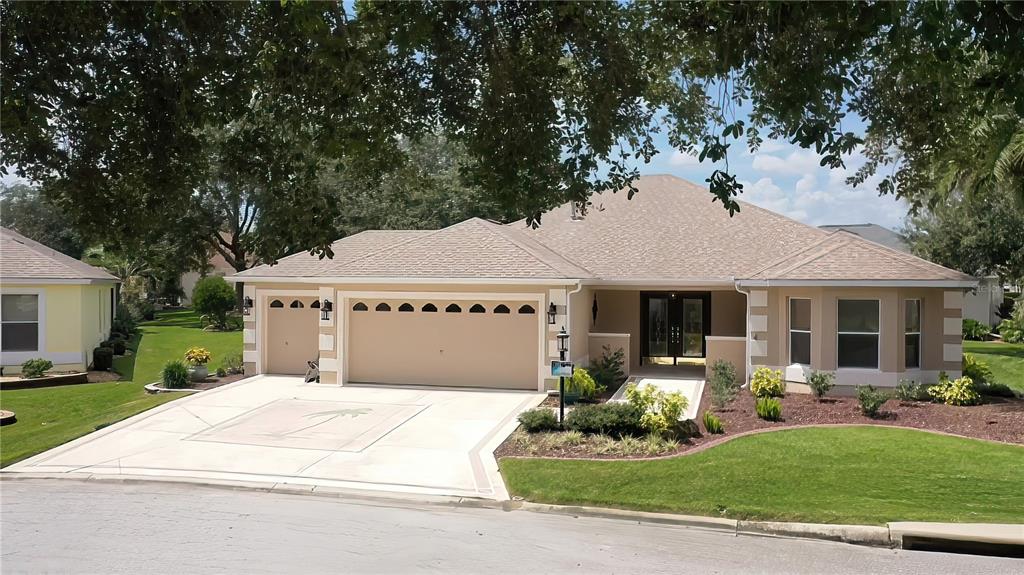This TURNKEY Block and Stucco Designer Home with GOLF CART GARAGE, NO BOND and ROOM FOR A POOL with the lot size of 10,119 SF lot (.23 of an acre) is located in the quiet Village of Chatham. As you approach this updated, 1796 SF Grand Ficus notice the beauty of the double lead glass front doors. This home has 2 bedrooms and 2 baths plus a dining room that could easily be converted into a den or 3rd bedroom. Both bedrooms are large enough to accommodate a king size bed. The pocket door allows privacy for the 2nd bedroom & bath making it like a 2nd master suit. Shiplap has been added to one wall in the 2nd bedroom. There is an additional 9’ x 13’ A/C – Heated, Glass Enclosed Lanai with scraped engineered flooring making it great for an office/den or an extra space for a private seating area as there are sliding glass doors on all 4 sides. The screen on the Bird Cage has been replaced in 2022. You will notice the upgrades as you enter the home starting with the open space and how all the floors have matching 5” wide solid bamboo planks with the exception of the Enclosed Lanai having the scraped engineered hardwood and the master bath having tile floors that match the tile on the shower walls. 5-inch Baseboards throughout and Crown molding have also been added in most rooms. Updated fans and lighting as well. The bathrooms have been remodeled with granite countertops, vessel sinks, bronze-colored faucets, comfort height toilets, newer style mirrors and lighting. The master shower was completely remodeled along with the shower fixtures. The wall between the living room and kitchen had been removed to create that open space feel. In the kitchen the granite was extended on the island to add a seating area. Black Stainless-Steel Stove, Dishwasher, Microwave and Refrigerator were replaced in 2020. Granite Composite sink and Faucet were also installed. The Gas Hot Water Heater replaced in 2020 and A/C Unit replaced in 2020. The Chatham recreation center is approximately 800’ from the home with 2 Executive Golf Courses, the Family Pool and Pickle Ball Courts. It is only 1 mile to Nancy Lopez golf course and approximately 5 minutes to Mulberry Grove Shopping. A quick golf cart ride to the New First Responders Recreation Center as well. Just about equal distance to Sumter Landing & Spanish Springs Town Squares. Minutes to Rt. 42 taking you to Rt. 301 or Rt. 441 where most the chain stores are. Note: TURNKEY – Some furniture and a few other items that are in the pictures have been removed from the home.