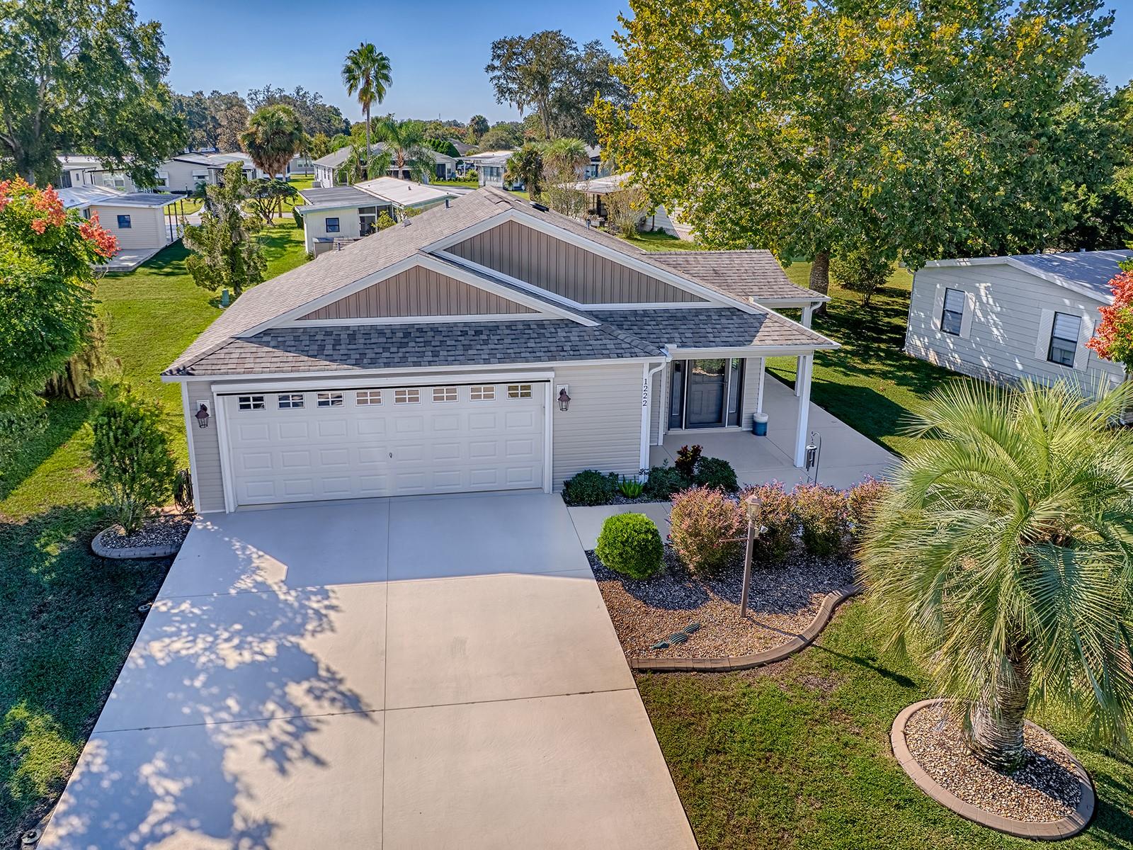 NO BOND! GREAT VALUE! Built in 2018, this is a ONE-OF-A-KIND & STUNNING HOME!  2 Bedroom/2 Bath/ 2.5 CAR GARAGE with BEAUTIFUL UPGRADES AND Custom Modifications!  Light & Bright with an EXPANDED OPEN FLOORPLAN providing Great Living Space - Volume Ceilings, & Laminate &/or Tile Flooring throughout.  Spacious Kitchen with GRANITE Counters, Complementary Backsplash, STAINLESS STEEL Appliances, PLENTY OF MAPLE CABINETS - PAN DRAWERS, 2 PANTRIES & 2 LAZY SUZAN'S plus a BREAKFAST BAR.  The Laundry closet is located in the kitchen for convenience so no going into the garage to do laundry. The IMPRESSIVE EXPANDED PRIMARY ENSUITE accommodates King-sized furniture, features a large walk-in closet, has a Walk-in ROMAN TILE SHOWER, and a GRANITE COUNTER, TWO SINK VANITY. The Second Bathroom with TILED Tub/Shower combo is conveniently adjacent to the GUEST BEDROOM.  Sliding Glass Doors from the Living Room take you to the Oversized Side Patio perfect for grilling and/or a perfect place to put a Hot Tub and enjoy the outdoors!  THE 2.5 CAR GARAGE has plenty of room for your vehicle(s) & golf cart and includes storage shelving, a storage closet & utility sink.  The home is wired for, and comes with, a Dual Fuel Portable Generator!  Located in The Villages of Silver Lake, close to Spanish Springs town Center, La Plaza Grande shopping center and across the street from The Silver Lake Recreation Center!  WHAT A PERFECT PLACE TO CALL HOME!  And/or could make for a Terrific Rental/Income Property!