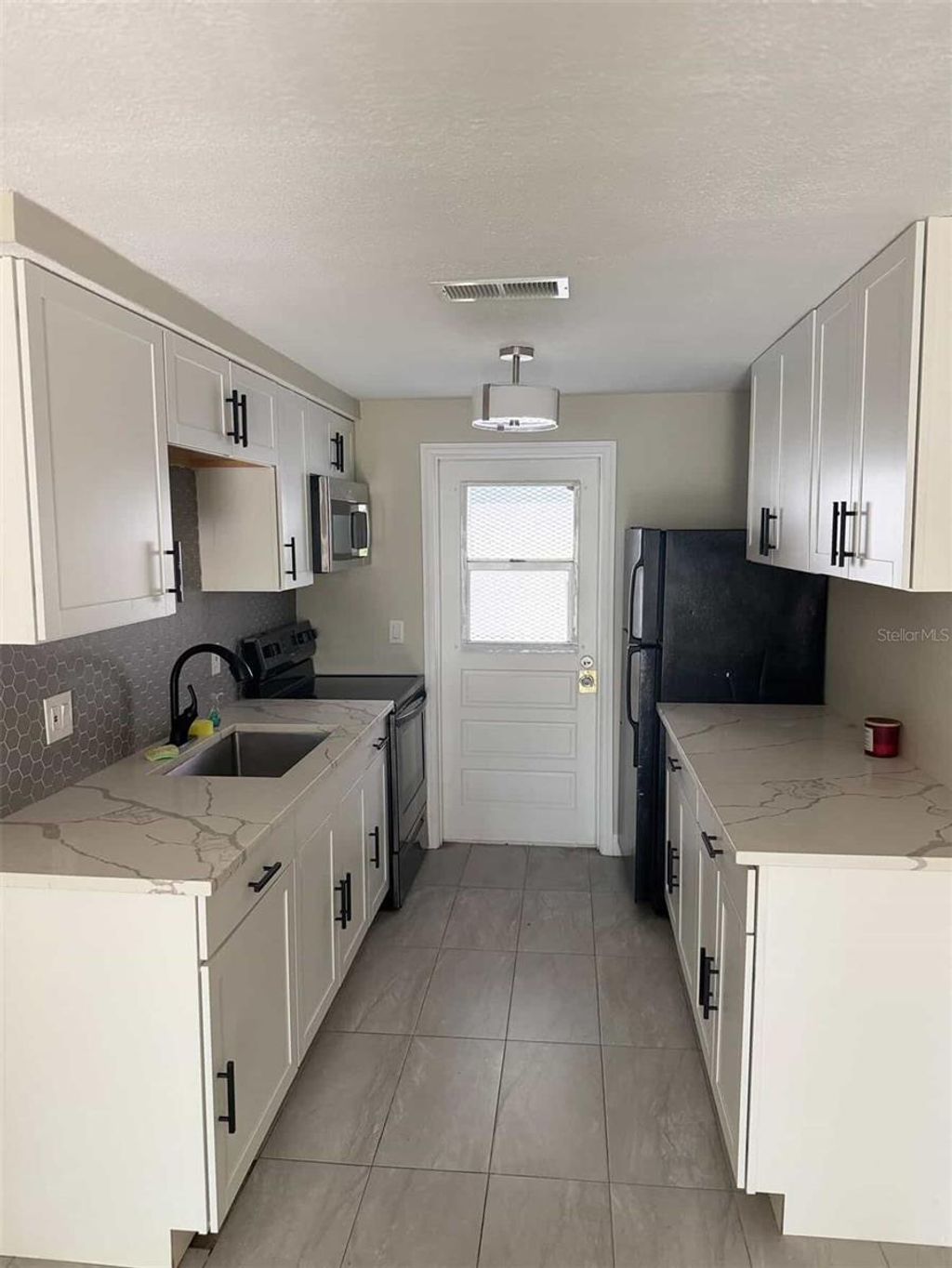 Photo of 1502 E Sewaha Street, Tampa, FL 33612 (MLS # TB8495157)