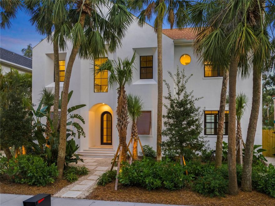 Welcome to Granada, a highly sought-after Sarasota neighborhood known for its mature tree-lined streets, character-rich architecture, and close proximity to the city’s best dining, shopping and beaches. This brand-new construction home is a stunning blend of Mediterranean and Moorish-inspired design, featuring bright white exteriors, graceful arches, and timeless curb appeal. Step inside to find warm wood floors, abundant natural light, and carefully curated designer finishes throughout. The gourmet kitchen boasts a built-in panel-front refrigerator, gas range, premium JennAir appliances, and Quartzite countertops—perfect for both everyday living and entertaining. The primary suite is conveniently located on the main level, complete with French doors opening to the stunning courtyard pool, creating a serene indoor-outdoor retreat. A versatile den or office is also located on the main floor. Upstairs, discover four spacious bedrooms and a generous bonus room that can serve as a media room, playroom, or family room. With 3,850 square feet of living space, five bedrooms, and four and a half baths, this all-block, two-story home was thoughtfully designed for modern comfort and flexibility—offering the ultimate Sarasota lifestyle.