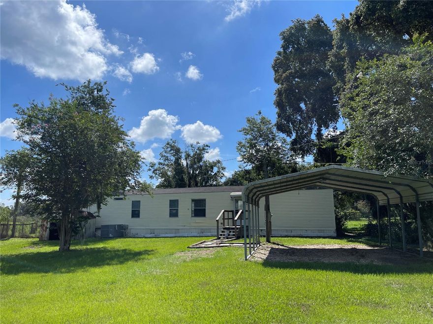 Discover the ultimate country living experience with this bright and spacious single-wide mobile home featuring 2 bedrooms and 2 full bathrooms. This hidden gem offers a screened-in back porch, a covered carport, and charming retro interior design. Inside, you’ll find Berber carpeting in the living and bedroom areas, with easy-to-clean linoleum flooring in the kitchen and bathrooms. The home includes plenty of storage space, a convenient outdoor shed, washer/dryer hookups, ceiling fans, and mirrored closet doors. Don’t miss out on this cozy and well-maintained home.