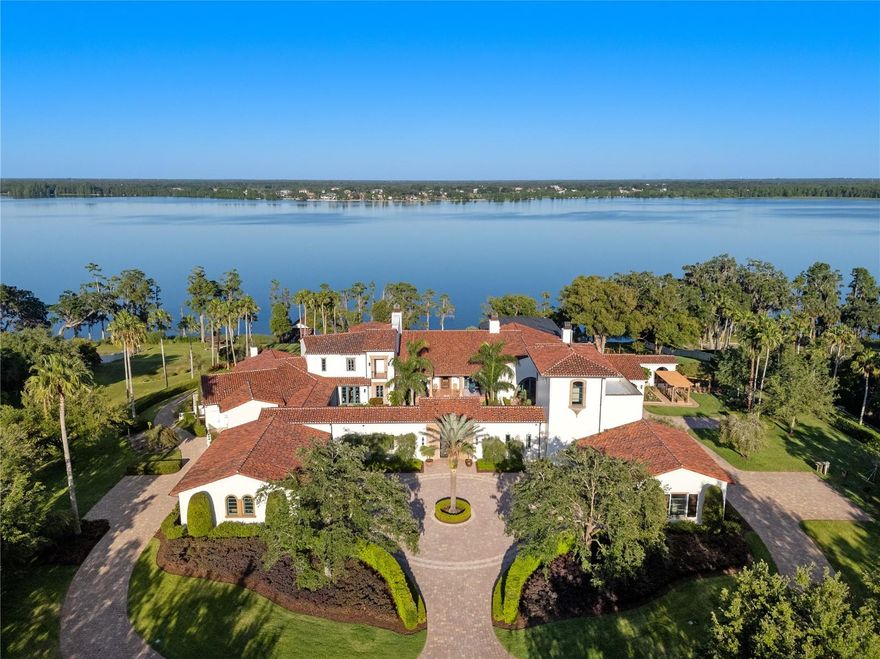 With partial owner financing available, we present an exceptional and truly rare opportunity: a distinguished lakefront estate coupled with an adjoining commercial parcel —perfectly suited for an expansive residential compound, corporate retreat, boutique hotel, or world-class wedding destination, where the possibilities are as expansive as the grounds themselves. Positioned on 22 gated acres and 682 feet of waterfrontage along Lake Thonotosassa, this residence boasts over 25,000 square feet of inspired architecture, redefining the concept of a private estate. Welcome to an iconic estate, where timeless elegance meets the serene beauty of nature. From the moment you arrive, you’ll sense the majesty of the property, the unparalleled craftsmanship, thoughtful design and breathtaking views that define this extraordinary residence. A grand entrance sets a stately tone, opening to elegant living areas and thoughtfully designed courtyards that offer tranquility and seclusion. A cheerful portico welcomes guests with colorful, professionally landscaped gardens, creating a warm and inviting first impression with vibrant seasonal blooms. Designed as a living work of art, the home features extraordinary architectural fidelity and intentional design at every turn. An immersive experience in American heritage and cultural elegance, the home includes a meticulously recreated Oval Office and a scaled replica of the famous Tampa Theatre, offering a cinematic environment rich in detail. A dedicated memorabilia room serves as a gallery of curated history. Craftsmanship with intention is evident throughout, with extensive custom millwork, precision moldings, elevated ceilings and artisanal finishes adorning every space. The estate comprises 6 luxurious suites, 12 opulent baths, and over 34,000 total square feet of inspired architecture and functionality. Unique additional rooms, terraces, galleries and conveniences are located strategically throughout. The scenic North Tower suite has a dedicated entrance and parking. Resort-style amenities offer a lagoon-inspired, tiered-level pool complete with cascading waterfall and a zero-entry edge, expansive outdoor entertaining areas and serene lake views, creating an ideal sanctuary for luxury living. This magnificent estate is suited for a discerning collector, history enthusiast or visionary seeking an enduring architectural legacy in the Tampa Bay region. But this listing is just half the story… The adjacent waterfront parcel with the commercial venue is being offered creating a once-in-a-generation opportunity to own both a luxury residence and fully operational event business. Together, the properties span 22 gated acres, making this the ultimate turnkey private residential compound or boutique hotel development, an elite corporate retreat center or a global wedding destination. Born from a dream and nurtured with love, Mision Lago is an immersive experience steeped in charm, purpose, and potential. The moment you pass through the gates, you feel the care and passion woven into every structure, every garden, every detail.  Up to 50% Seller financing available - call today for more information.