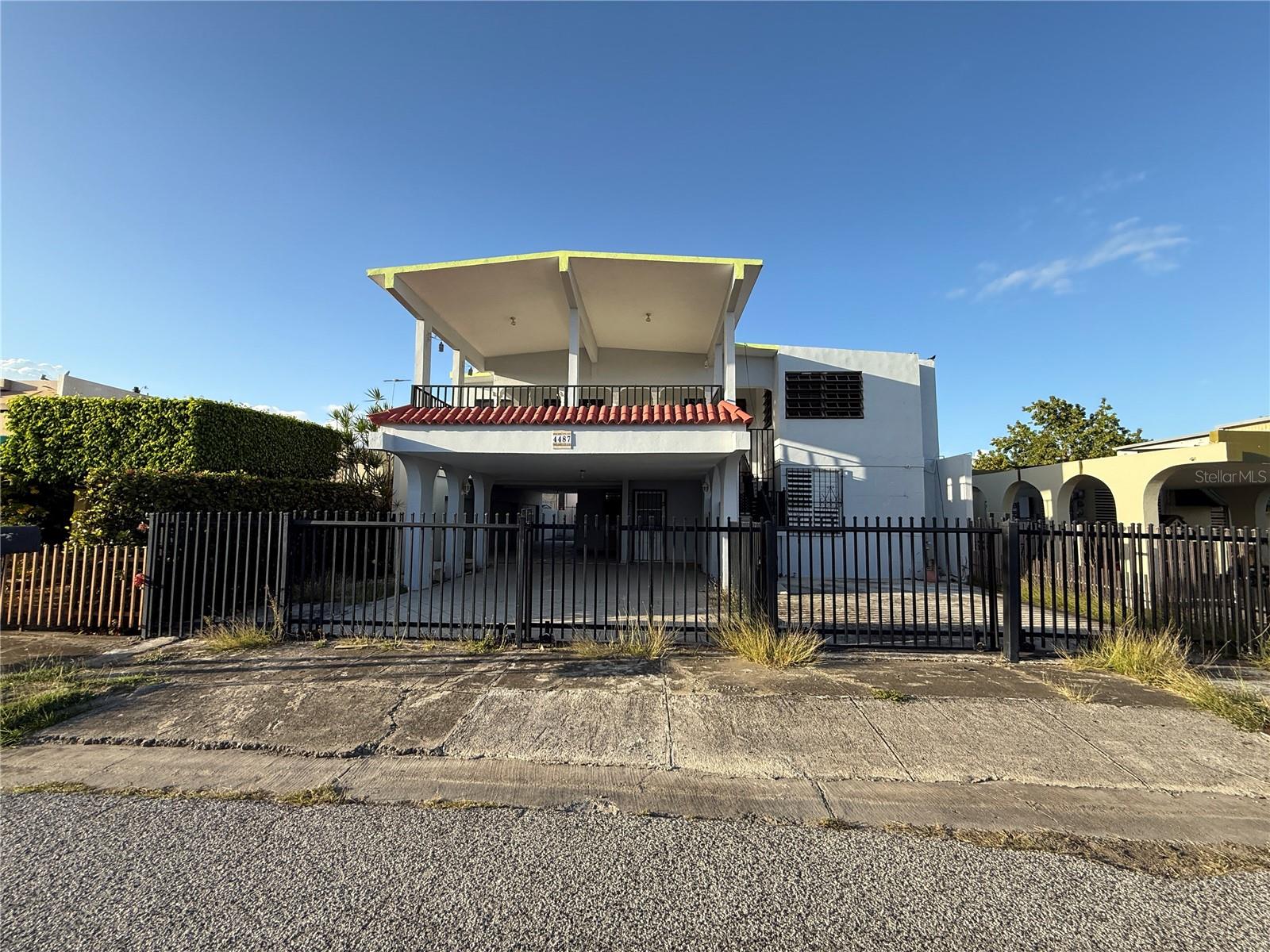 MULTI FAMILY PROPERTY FOR SALE in Ponce Puerto Rico. House For Sale in Urbanizacion Punto Oro Alameda St # 4487 ( N-11) , Lot Size is 325 square meters, (.08 Acres) ; Gross Square Living Area is 2,489 sq ft . UNIT A (Downstairs ) has four (4) Bedrooms and two (2) Bathroom. Double Garage (extended area for 4 cars ) . Kitchen and some areas may need repairs. UNIT B (Upstairs ) has three (3) bedroom and two (2) baths with is own private access and another carport area for (2) two cars. Each unit has its own electric and water meter separate. *(Observations; Property May Need some repairs or modifications if the buyer is going to have a mortgage loan in order to buy it)* Please look all the pictures and scroll all to the left and right in order to view all prior to scheduling an appointment. The area is residential code with a potential for rental purposes. Near to many amenities like shopping mall, super markets, gas stations, easy access to Highway PR -2 and PR-52. Near to Mercedita Airport. 45 minutes driving to Cabo Rojo Beach Town. Coordinates for the location of this property are 17°59'36.1"N 66°38'45.8"W . If you may want to know more about it please text, what's app , email or call to our office with the code "Punto Oro" or MLS Number: PR9113830 . It is suggested that the buyer must have at least twenty five or thirty p e r c e n t from the sales price in order to have a Conventional Non Conforming Type Loan.