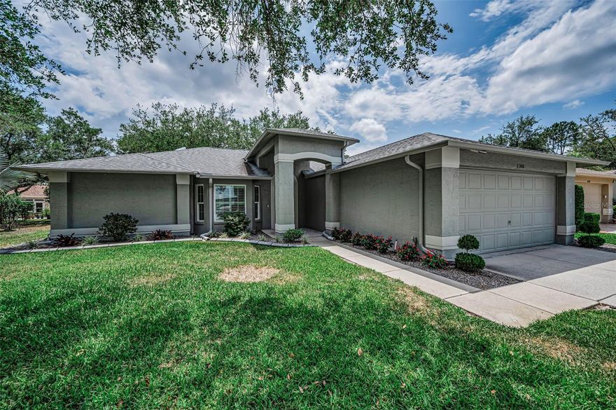 One or more photo(s) has been virtually staged. Welcome to this beautiful 2-bedroom, 2-bath home with a spacious family room and Florida room, offering over 1,800 sq ft of comfortable living space. This home is packed with major updates for peace of mind, including a NEW ROOF (2019), NEW IMPACT WINDOWS throughout (2018), NEW SOLAR PANEL SYSTEM (2019), and newer HVAC (2017). The energy-efficient solar system powers the home approximately 50% of the time, keeping the average electric bill around just $90/month. Another feature is a PREMIUM WHOLE HOUSE WATER TREATMENT SYSTEM. Designed with the sought-after “Florida flow", this popular Victoria model sits on a picturesque, park-like lot. The beautifully updated kitchen features new cabinetry, granite countertops, granite backsplash, stylish tile flooring, and a charming breakfast nook. The open-concept layout allows the kitchen to overlook the family room—perfect for everyday living and entertaining. Sliding glass doors from both the kitchen and living/dining areas lead out to the expansive Florida room, creating seamless indoor-outdoor living. Additional highlights include plantation shutters on all windows, fresh interior and exterior paint in neutral tones, and an oversized two-car garage. The spacious primary suite offers two walk-in closets and a beautifully updated ensuite bath with a dual granite vanity and a large tiled walk-in shower. The guest bedroom is generously sized with its own walk-in closet, and the second bath has also been tastefully updated with granite and a glass-enclosed tiled shower. Relax and unwind in the large Florida room while enjoying serene views of the lush, park-like surroundings. This home is located in a vibrant, amenity-rich community featuring a clubhouse, heated pool and spa, golf course, restaurant, fitness center, tennis courts, library, and a full calendar of activities and events. Conveniently located near beaches, shopping, dining, medical facilities, and Tampa International Airport—this home truly offers the best of Florida living!