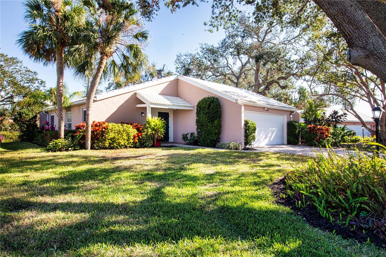 Welcome to Las Casas, a pet-friendly boutique 55+ community of just 22 detached villas, located 8 miles from downtown Sarasota and the Gulf Coast beaches. Nestled on a private cul-de-sac backing onto McArthur Park, this villa offers excellent curb appeal and a peaceful setting. Recently updated, the home features new luxury vinyl plank flooring and has been freshly painted inside and out. The open floor plan includes well-defined living spaces of living room, dining room and a versatile bonus room which leads to a newly paved back patio, where you can relax amid mature landscaping. The primary suite is generously sized, with a walk-in closet and an ensuite bathroom. The split floor plan places the second and third bedrooms on the opposite side of the home, providing privacy for guests or family members. Bedroom three includes built-ins and a Murphy bed, adding functionality to the space. Homes in this desirable community live like single-family residences but are maintained under a condominium model with modest monthly HOA fees. These fees include all lawn care and access to a community pool and clubhouse, conveniently located next door. The clubhouse offers a large social area and a kitchen, ideal for hosting gatherings and events.
This quiet, well-maintained neighborhood is close to SRQ Airport, University Parkway, the Asolo Theatre, and the Ringling Museum, making it a prime location for enjoying Sarasota's cultural attractions. Don’t miss your chance to see this villa. (Some images have been virtually staged for ease of viewing.)