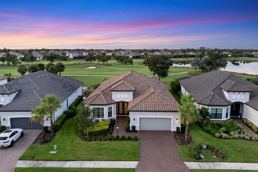 EXQUISITELY DESIGNED POOL HOME IN THE PREMIERE GOLF COMMUNITY OF ESPLANADE AT AZARIO, OFFERING MAGNIFICENT GOLF COURSE VIEWS AND GOLF CLUB MEMBERSHIP IS INCLUDED! This beautifully appointed residence showcases a unique blend of luxury and design, featuring a spacious Great Room overlooking picturesque golf course vistas that seamlessly transition to an exceptional outdoor living space thoughtfully designed for contemporary living. Expansive Travertine Shellstone Lanai surface, Covered Gathering areas, an OUTDOOR KITCHEN WITH BAR, GAS FIREPLACE, SPARKLING SALTWATER HEATED POOL AND SPA with Pebbletec finish and Panoramic Clear Vue Screen overlooking golf and water views is ideal for embracing the Florida lifestyle. Elegant interior finishes include PORCELAIN TILE FLOORS, TRAY CEILINGS, CROWN MOLDING, QUARTZ COUNTERTOPS, 8 FOOT DOORS, and IMPACT WINDOWS AND DOORS throughout along with plantation shutters and motorized shades in great room and kitchen. This area integrates a dining space and a gourmet-style kitchen, perfect for both entertaining and relaxation. The chef's kitchen is equipped with wood cabinetry, tile backsplash, a generous island with a breakfast bar for casual dining, additional prep sink, GE MONOGRAM APPLIANCES including a built-in refrigerator and oven, 6 burner gas cooktop with pot filler, professional series range hood with warming lamps, R.O. water filtration, walk-in pantry, and a beverage center. Retreat to the private owner's suite with bay window providing serene outdoor views and a lavish bath featuring a dual bowl vanity with dedicated makeup area, an expansive walk-in shower with multiple shower heads and a generous built-in closet. The desirable split bedroom and bath plan ensures privacy for family and guests, with an ensuite bedroom and bath and front bedroom adjacent to the hall bath which includes a king-size Murphy bed. The versatile study is ideal for a home office, game room, or your favorite hobbies. A separate laundry room includes a convenient drop-in sink, upper and lower cabinets, and front-load washer and dryer. The three-car tandem garage, complete with an epoxy finish floor, offers ample space for a golf cart. Complimented by a paver drive and walkway, outdoor lighting, gutters, barrel tile roof, whole house KOHLER GENERATOR and TANKLESS GAS WATER HEATER with RECIRCULATING PUMP, this exceptional home is conveniently situated across the street from a satellite pool, dog park, and community garden. The highly amenitized community boasts a socially active resident CLUBHOUSE, state-of-the-art FITNESS CENTER, Spa and SALON, TENNIS and PICKLEBALL courts, RESORT STYLE POOL with BAHAMA BAR, CULINARY CENTER, BARREL HOUSE BISTRO and an 18-HOLE CHAMPIONSHIP GOLF COURSE, PRO-SHOP and AQUA DRIVING RANGE. Experience life in Lakewood Ranch, the nation's #1 multi-generational community, where you are minutes to dining, shopping and events at Lakewood Ranch Main Street and Waterside Place. The location offers close proximity to the UTC Shopping Mall, Benderson Rowing Park, New Mote Marine Aquarium, and I-75 for convenient travel north and south, and you are approximately 30 minutes from downtown Sarasota's vibrant cultural venues, diverse dining options, and our stunning Gulf Coast Beaches!