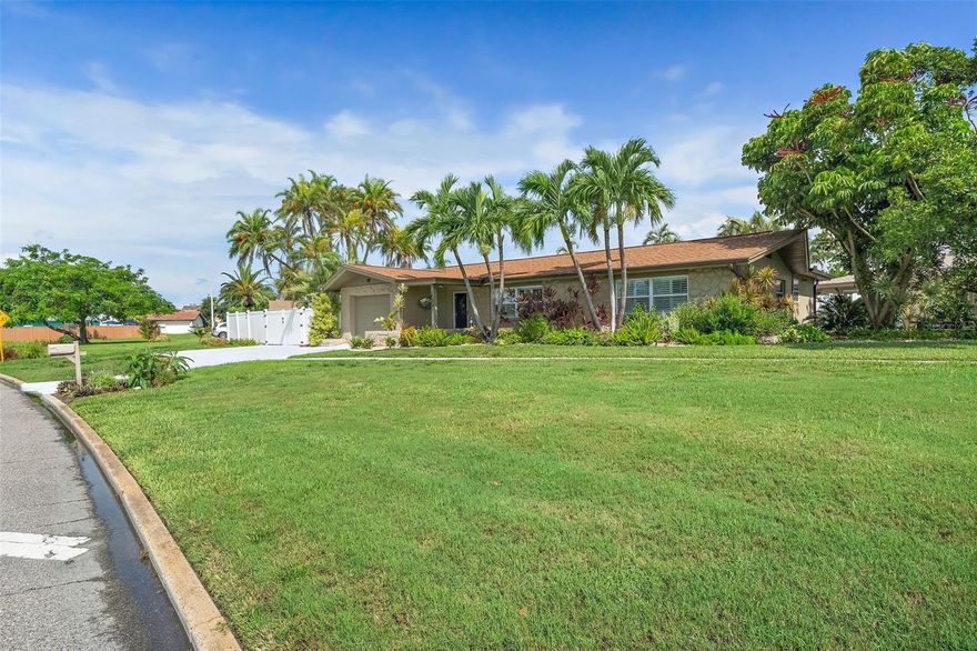 Price improvement! Property being removed from the market 10/31/2025. Don't miss this opportunity! Fabulous Pool Home nestled in the heart of the coveted Tierra Verde community; this stunning home offers the perfect blend of modern updates and tropical charm. Located at the southern tip of St. Petersburg, Florida, Tierra Verde is renowned for its laid-back boating and fishing lifestyle, with direct access to nature and the beautiful Fort De Soto Park. Step inside to discover a fully updated kitchen featuring solid surface countertops, custom cabinetry, stainless steel appliances, a vent hood, and recessed lighting, all enhanced by high-quality fixtures. Both bathrooms have been elegantly updated with custom vanities, granite countertops, tile shower enclosures, and stylish fixtures and lighting. The home boasts diagonal tile throughout, creating a seamless flow from room to room. The spacious laundry room is equipped with built-in cabinetry for added convenience and storage. Outside, you'll find your own private tropical oasis. The lagoon-style pool is surrounded by lush landscaping, offering complete privacy, while the expansive lanai and pergola provide the perfect setting for outdoor dining or relaxing. There’s also an additional parking pad ideal for boat or RV storage. With its prime location, you'll have easy access to all Tierra Verde has to offer. The pristine Gulf beaches are just a short bike ride away, and you're only moments from some of the area's best fishing and nature spots. Plus, this home has not been affected by flooding, offering peace of mind for years to come. Whether you're looking for a seasonal retreat or a permanent residence, this home offers the ideal balance of luxury, comfort, and convenience. Pride of ownership is evident throughout – it’s a must-see!