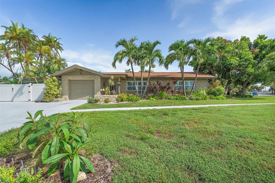 Price improvement! Property being removed from the market 10/31/2025. Don't miss this opportunity! Fabulous Pool Home nestled in the heart of the coveted Tierra Verde community; this stunning home offers the perfect blend of modern updates and tropical charm. Located at the southern tip of St. Petersburg, Florida, Tierra Verde is renowned for its laid-back boating and fishing lifestyle, with direct access to nature and the beautiful Fort De Soto Park. Step inside to discover a fully updated kitchen featuring solid surface countertops, custom cabinetry, stainless steel appliances, a vent hood, and recessed lighting, all enhanced by high-quality fixtures. Both bathrooms have been elegantly updated with custom vanities, granite countertops, tile shower enclosures, and stylish fixtures and lighting. The home boasts diagonal tile throughout, creating a seamless flow from room to room. The spacious laundry room is equipped with built-in cabinetry for added convenience and storage. Outside, you'll find your own private tropical oasis. The lagoon-style pool is surrounded by lush landscaping, offering complete privacy, while the expansive lanai and pergola provide the perfect setting for outdoor dining or relaxing. There’s also an additional parking pad ideal for boat or RV storage. With its prime location, you'll have easy access to all Tierra Verde has to offer. The pristine Gulf beaches are just a short bike ride away, and you're only moments from some of the area's best fishing and nature spots. Plus, this home has not been affected by flooding, offering peace of mind for years to come. Whether you're looking for a seasonal retreat or a permanent residence, this home offers the ideal balance of luxury, comfort, and convenience. Pride of ownership is evident throughout – it’s a must-see!