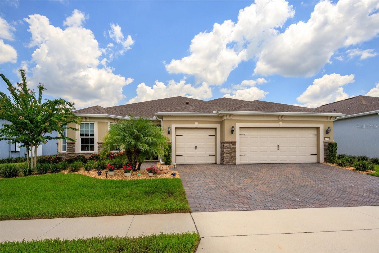 Welcome to your Florida dream home in Del Webb Sunbridge, a vibrant, guard-gated 55+, active community where resort-style living meets everyday convenience. Built in 2020 with an emphasis on quality & comfort, this single-story residence offers 4 bedrooms & 2½ baths across a thoughtfully designed 2,321-square-foot floorplan. From the moment you arrive, lush landscaping, a paver driveway & 3-car garage set an inviting tone. Step inside to discover airy tray ceilings, neutral tile floors & abundant natural light. The open living & dining areas flow seamlessly into a gourmet kitchen adorned with granite countertops, a gas cooktop, microwave, convection oven, dishwasher & refrigerator with natural gas dryer. A large center island with pendant lighting invites conversation & casual dining, while a walk-in pantry keeps everything organized. The built-in dry bar & beverage station are perfect for entertaining.
--------------------------------------------------------------------------------------
Just off the foyer, a fourth bedroom currently serves as a spacious home office; simply add a closet and you have a true fourth bedroom. Flexibility that adapts to your needs. The primary suite offers serene views, plush carpeting & a spa-like bath with dual sink vanity, solid-surface counters & an oversized glass-enclosed shower with bench seat. You’ll love the enormous walk-in closet for effortless organization. Two additional guest rooms share a beautifully appointed full bath, while a convenient powder room near the living area accommodates visitors. The laundry room includes gas dryer hook-up, extra storage & space for fitness equipment, etc. Sliding doors extend the living space onto a 35-ft covered & screened lanai, creating an indoor-outdoor sanctuary. The covered area is ideal for al-fresco dining, while the open area, with travertine pavers & soft landscape lighting, provides plenty of room for container gardening or a morning yoga session.
------------------------------------------------------------------------------------
Additional features include central heating & cooling, gas tankless water heater & in-wall pest-control system. HOA fees cover lawn care, cable, internet & 24-hour guard service, making life effortless. Located minutes from Lake Nona, Medical City, Orlando International Airport & major highways, this property delivers both tranquility & convenience. Del Webb Sunbridge is renowned for its exceptional amenities & active-adult lifestyle. Residents enjoy the 27,000-square-foot Hammock Club with a resort-style zero-entry pool, lap lanes, resistance pool, heated spa & Sabal Tavern restaurant with outdoor seating. Stay social with a ballroom, arts & crafts rooms and a demo kitchen for cooking classes, or meet friends at the outdoor amphitheater & fire pits. Fitness enthusiasts appreciate the fully equipped fitness center, group-exercise studio, pickleball & tennis courts. There’s even a dog park & covered grill pavilion for year-round gatherings.
---------------------------------------------------------------------------------
The community’s Lifestyle Program offers diverse clubs, cultural events, concerts, seminars & game nights to keep you engaged & active, ensuring your social calendar is as full as you desire. Why settle for the ordinary when you can live in a home that embodies comfort, style & resort-caliber amenities? Schedule your private tour today & experience the Del Webb Sunbridge lifestyle for yourself.