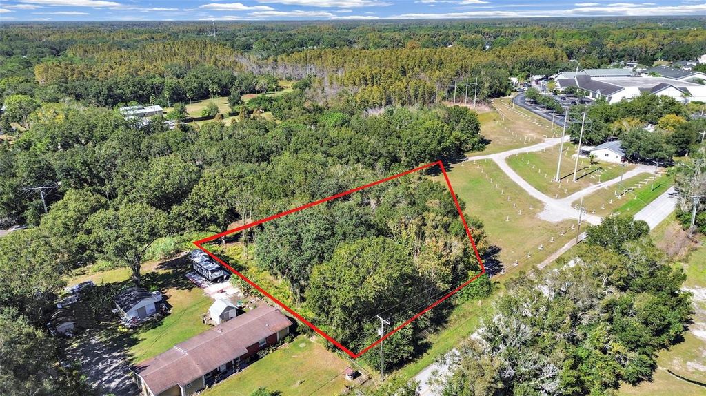 Photo of 16906 Lakeshore Road, Lutz, FL 33558 (MLS # TB8450301)