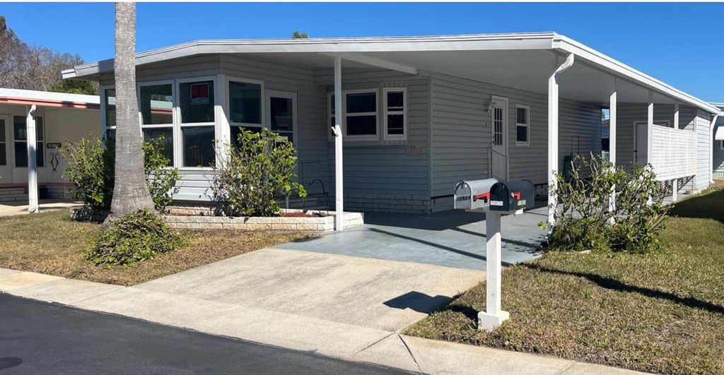 Photo of 10924 Federal Drive, Port Richey, FL 34668 (MLS # TB8478455)