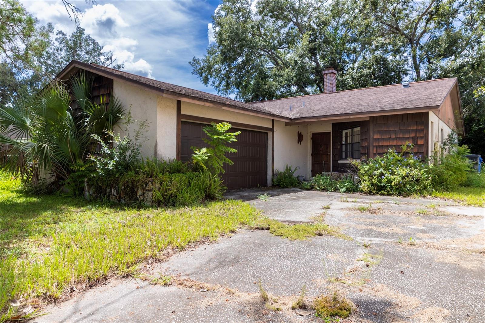 Whether you’re an investor or handy homeowner looking for a project, this home is full of possibilities! This 3-bedroom, 2-bath home just under 1,500 sq ft of living space has tons of potential. This home will need an estimated $50k in repairs. But inside, you’ll find a great layout, cozy fireplace, open kitchen overlooking the main living area, and a versatile front room that can serve as a home office or even a 4th bedroom. The 2-car garage and extended driveway provide plenty of parking and room for storage. With no HOA you’ll enjoy extra freedom and savings. Come take a look; it might be the opportunity you’ve been searching for.