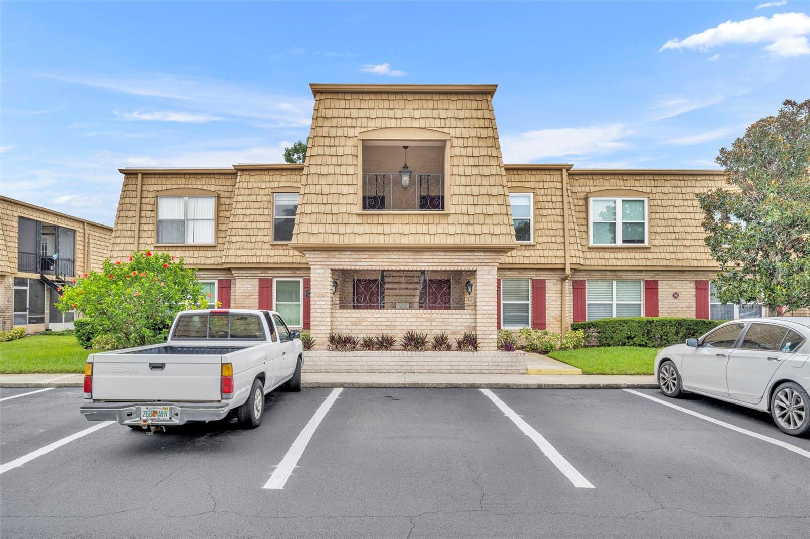 Beautifully updated first-floor condo in the sought-after Four Seasons community. Step inside to a bright, inviting open floor plan with laminate floors, a spacious living room, separate dining area, and a kitchen featuring white cabinetry, granite countertops, and access to the outdoors. The large primary bedroom includes a walk-in closet and updated en suite bath, and the second bedroom is generously sized with access to an updated hall bath. Enjoy a cozy screened porch with a laundry closet and serene views of lush green space. Four Seasons offers tennis courts, three sparkling pools, and a prime location near shopping, dining, and just minutes to downtown Winter Park.