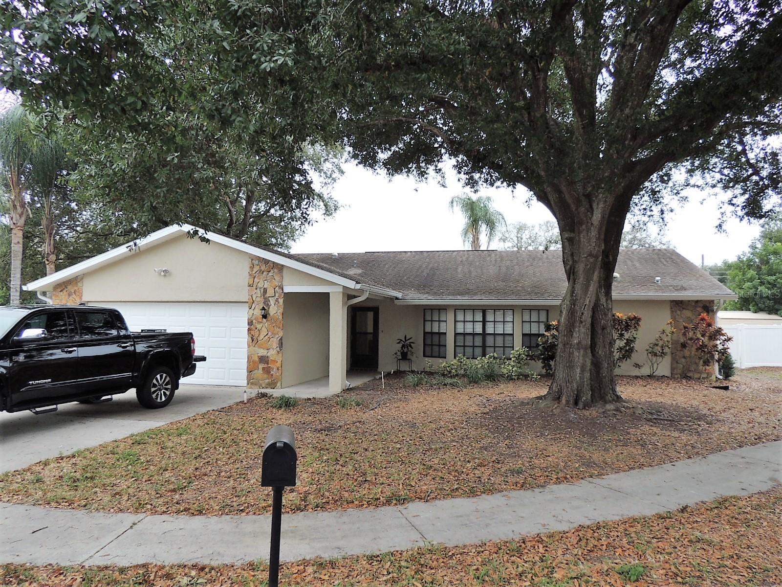 Within the City of New Port Richey we have a super cute 4 bedroom 2 bathroom 2 car garage, updated home with vaulted ceilings, ceiling fans, stainless appliances, tile floors throughout, wooden shaker cabinets and vanities, granite counters and updated tiles in showers, walk in closet(s) and a screened in back porch as well as a fenced in yard on a quiet street with not a lot of traffic and close to shopping and major roads. Trash and Lawn Included.