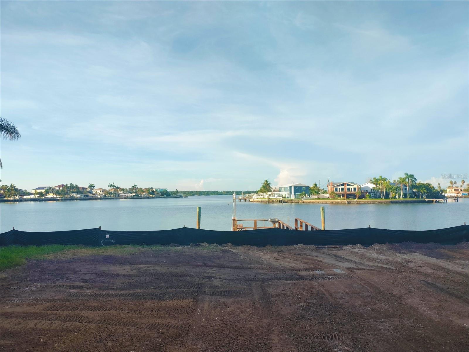 Vacant Lot: No home on this property: BUILD YOUR PERSONAL PARADISE IN REDINGTON BEACH! This 75x100 rectangular lot features a beautiful unobstructed view of the intercoastal, and boat assess to John's Pass and then out to the Gulf. Newer seawall done in 2021. Many new homes have been built in this area on lots such as this one....so build your dream waterfront home right here! A short drive to lovely St. Pete and Tampa. Multiple parks and beach accesses are within walking distance. Walking distance to local shopping/restaurants. This land is ready for you to make your waterfront living dreams come true!