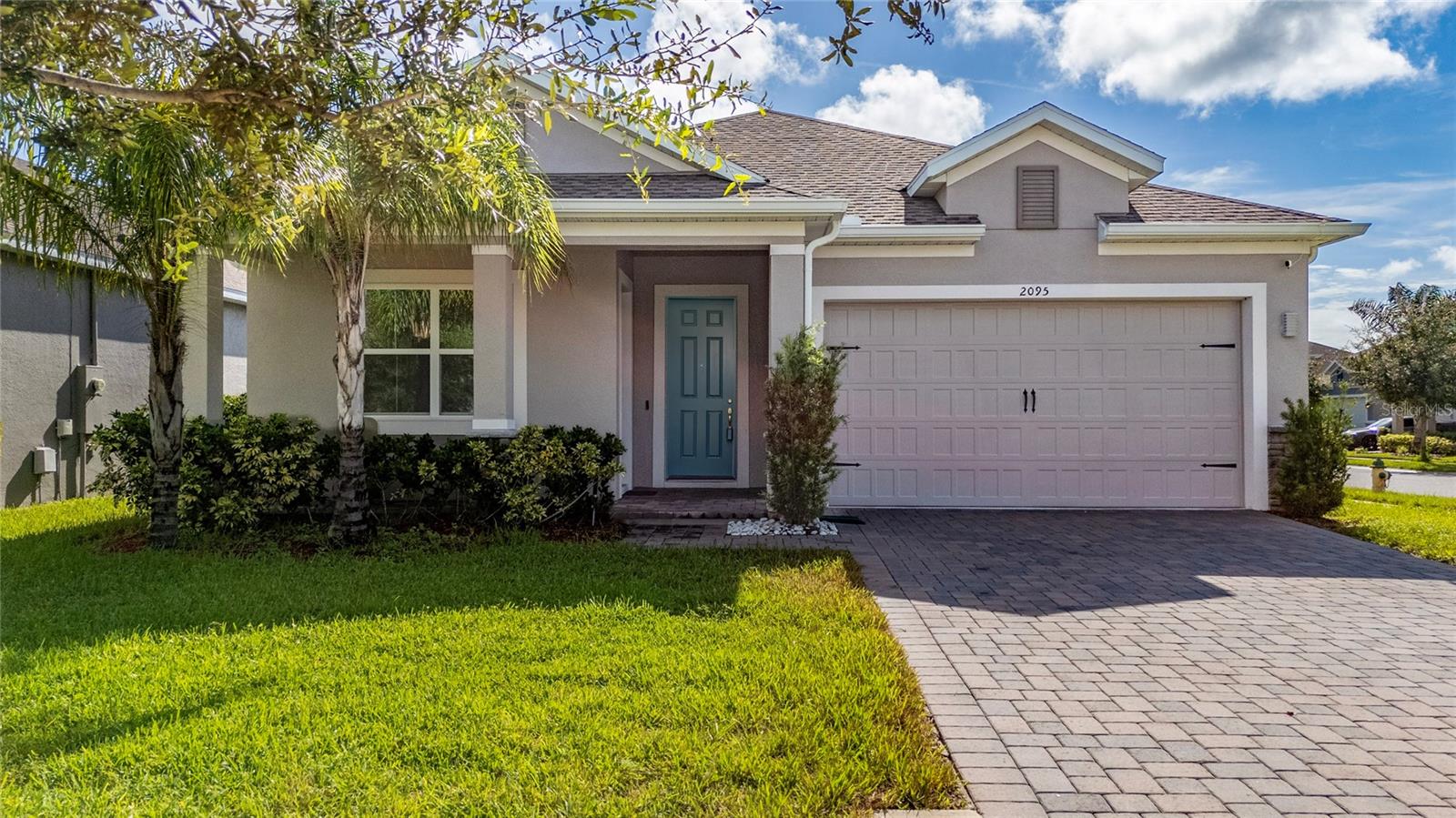 $13K SELLER CREDIT FOR CLOSING COSTS! Welcome to this MULTIGENERATIONAL corner property featuring a thoughtfully designed layout perfect for extended family living or rental income potential. This well-maintained home offers the unique advantage of a completely separate in-law suite with its own private entrance, ensuring privacy and independence for all occupants, a full kitchen, laundry facilities, and dedicated AC system. This desirable corner lot property features complete fencing for privacy and security, while the installed solar panel system provides energy efficiency with buyer assumption of the existing solar loan. Inside the main residence, each room provides ample space and natural light, while the bathrooms has modern fixtures and thoughtful layouts. The heart of the home features a stunning gourmet kitchen with rich wood cabinetry, elegant granite countertops, and a spacious center island perfect for meal preparation and casual dining. Premium stainless steel appliances include a built-in microwave and wall oven configuration, complemented by modern pendant lighting and stylish tile flooring throughout. The open-concept design allows the kitchen to flow seamlessly into the main living areas. This home combines suburban tranquility with convenient access to Central Florida attractions and amenities. - MUST SEE!!